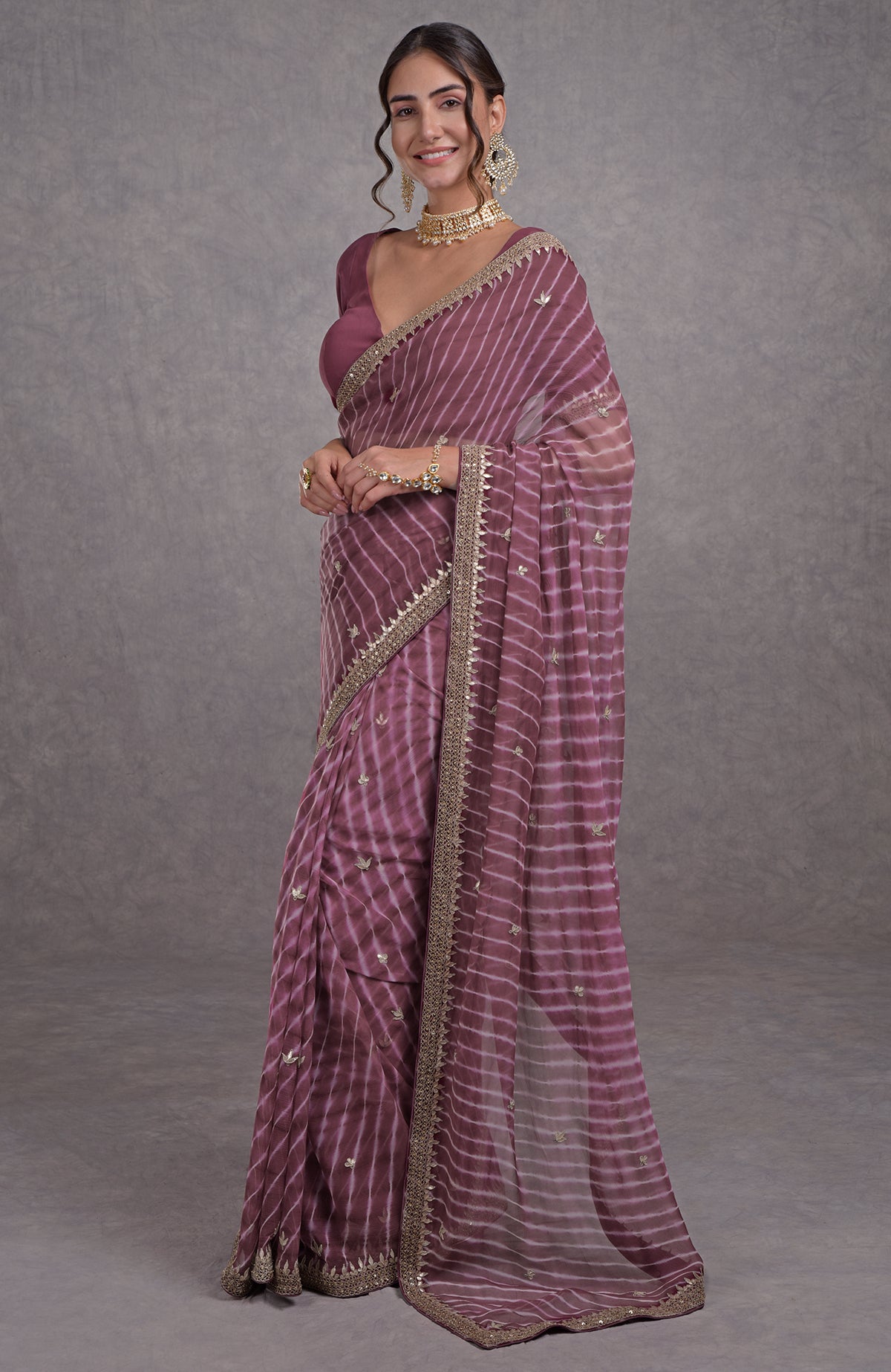 Burgundy chiffon saree with purple leheriya and rose gold marori-gota patti hand embroidery.