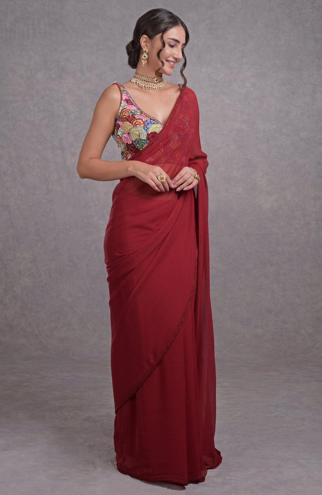 Red saree with multicolor floral resham, dabka, sequin, bead embroidery and sweetheart blouse neckline