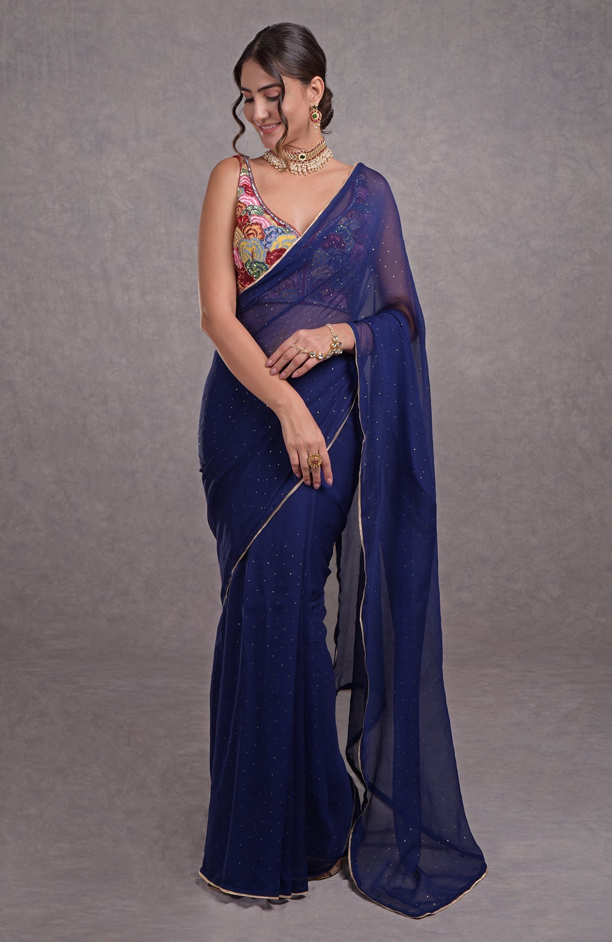 Classic blue saree with multicolor resham, dabka, sequin, bead, and kamdani hand embroidery.