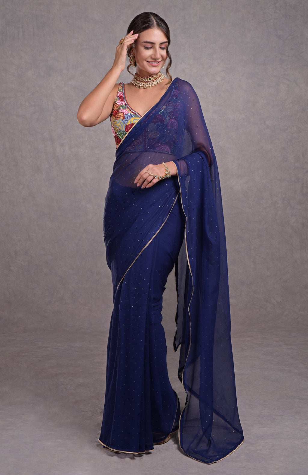 Classic blue saree with multicolor floral resham, dabka, sequin, bead, and Kamdani embroidery.