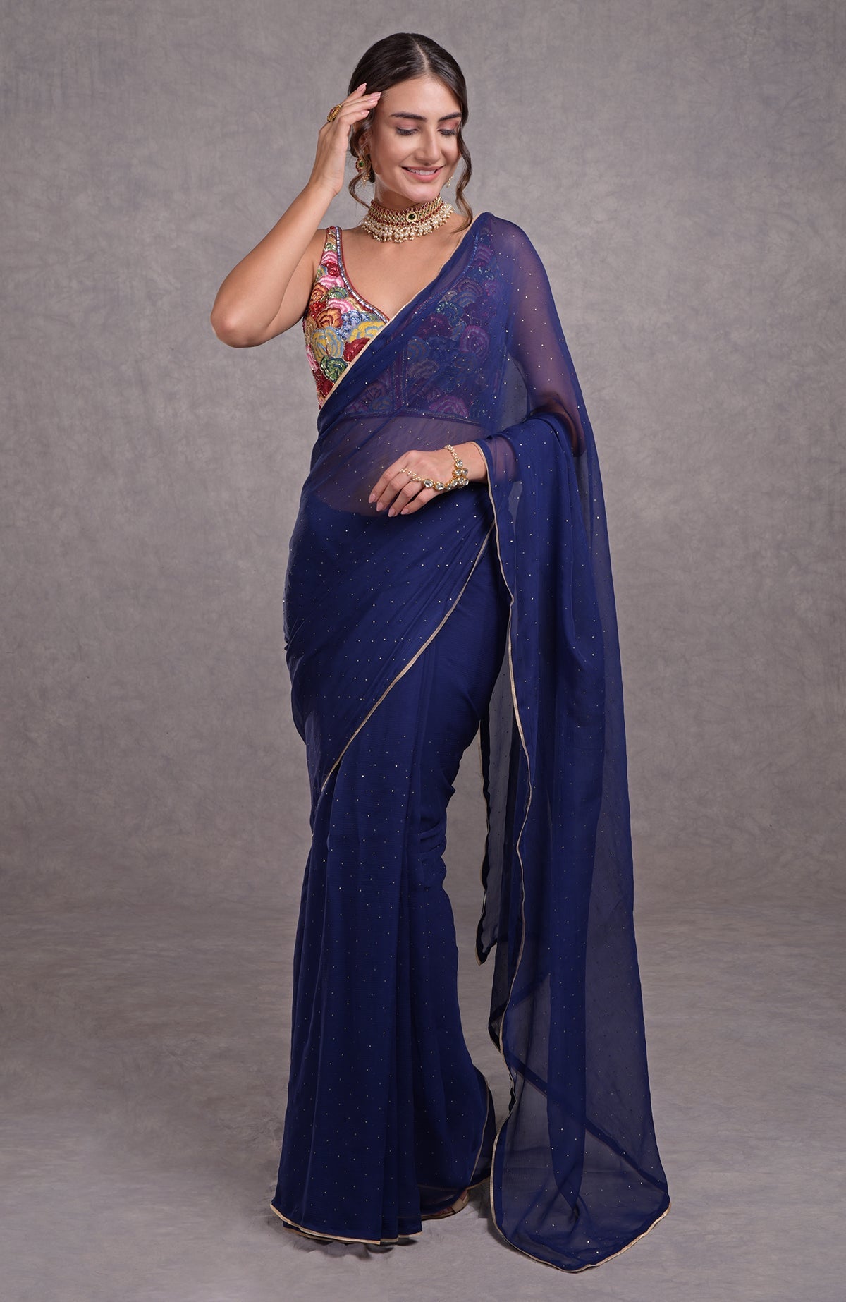Classic blue saree with multicolor floral resham, dabka, sequin, bead, and Kamdani embroidery.