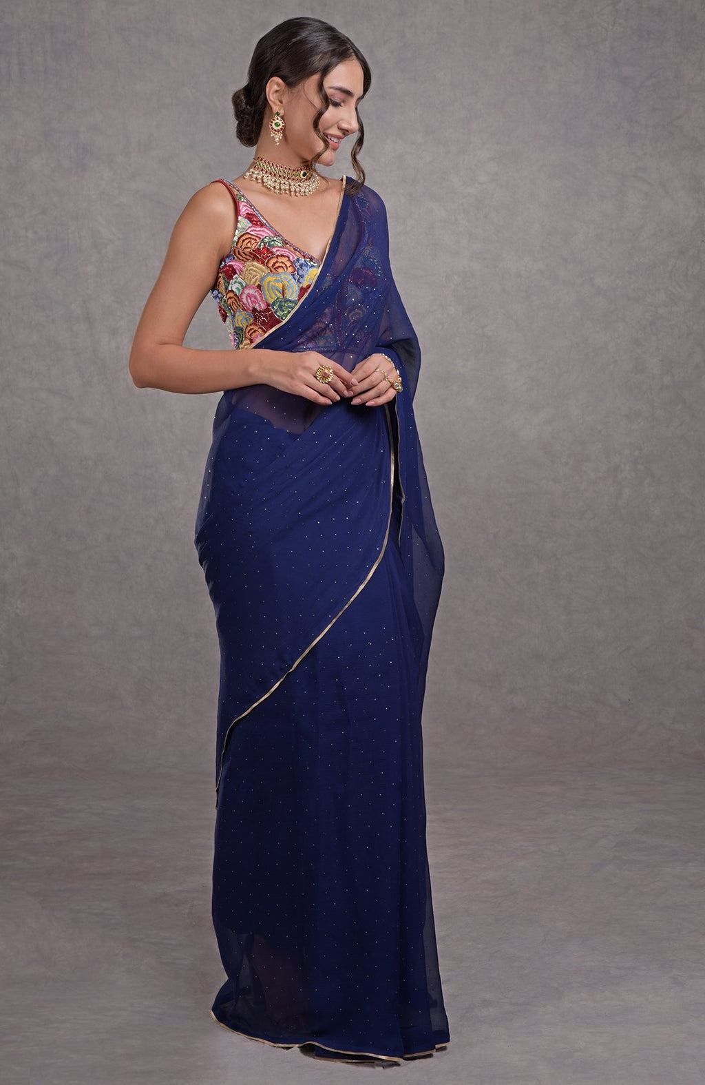 Classic blue saree with multicolor floral resham, dabka, sequin, bead, and Kamdani embroidery.