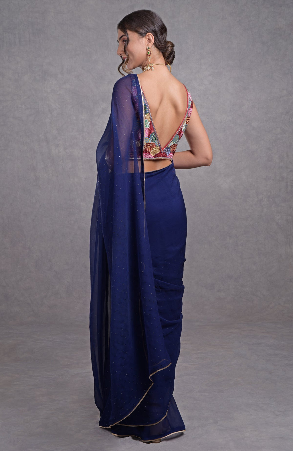 Classic blue chiffon saree with multicolor resham, dabka, sequin, bead, and kamdani embroidery.