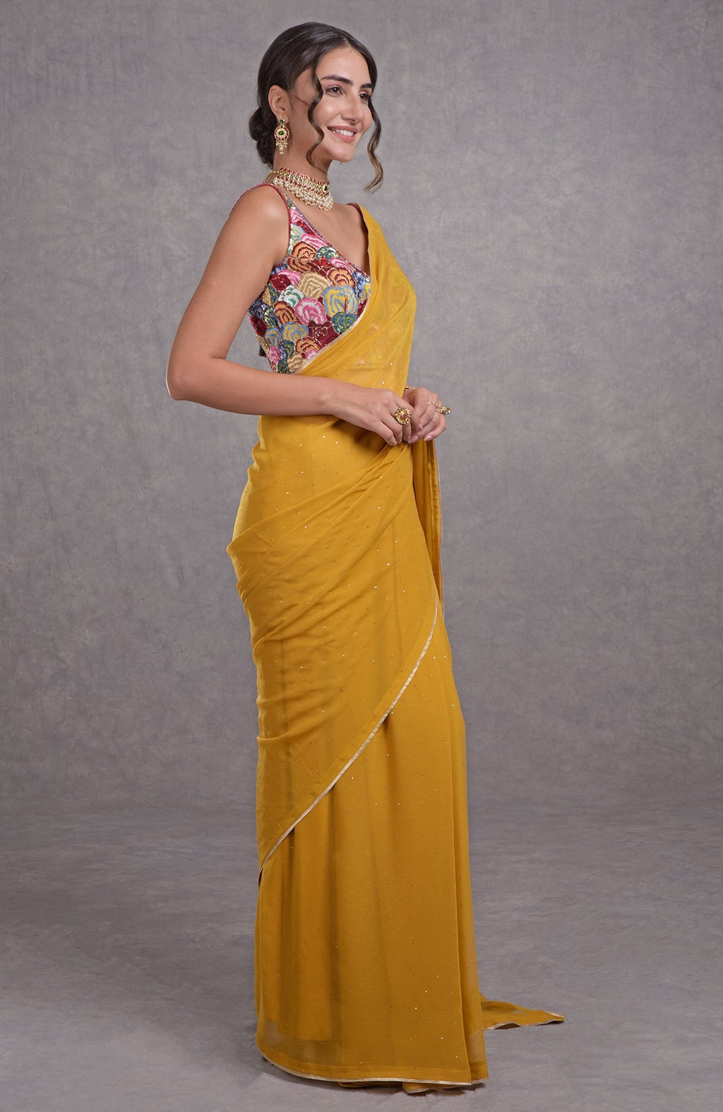 Mustard yellow saree with multicolor resham, dabka, sequin, bead, and Kamdani hand embroidery.