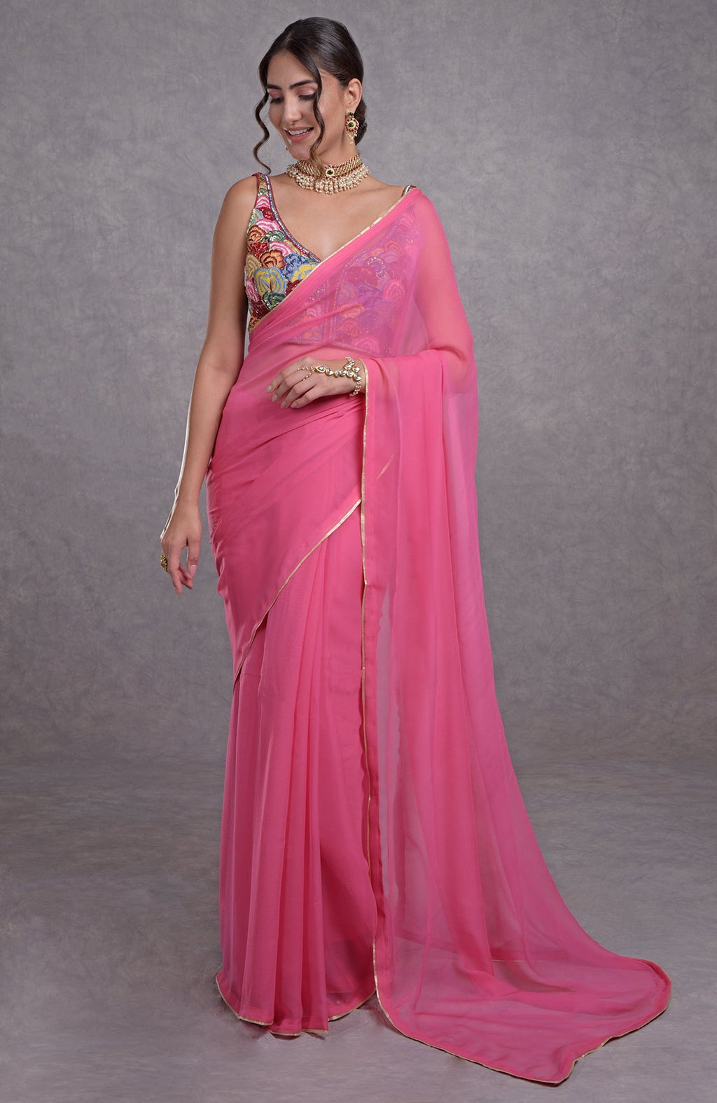 Hot pink saree with multicolor resham, dabka, sequin, and bead floral embroidery on blouse