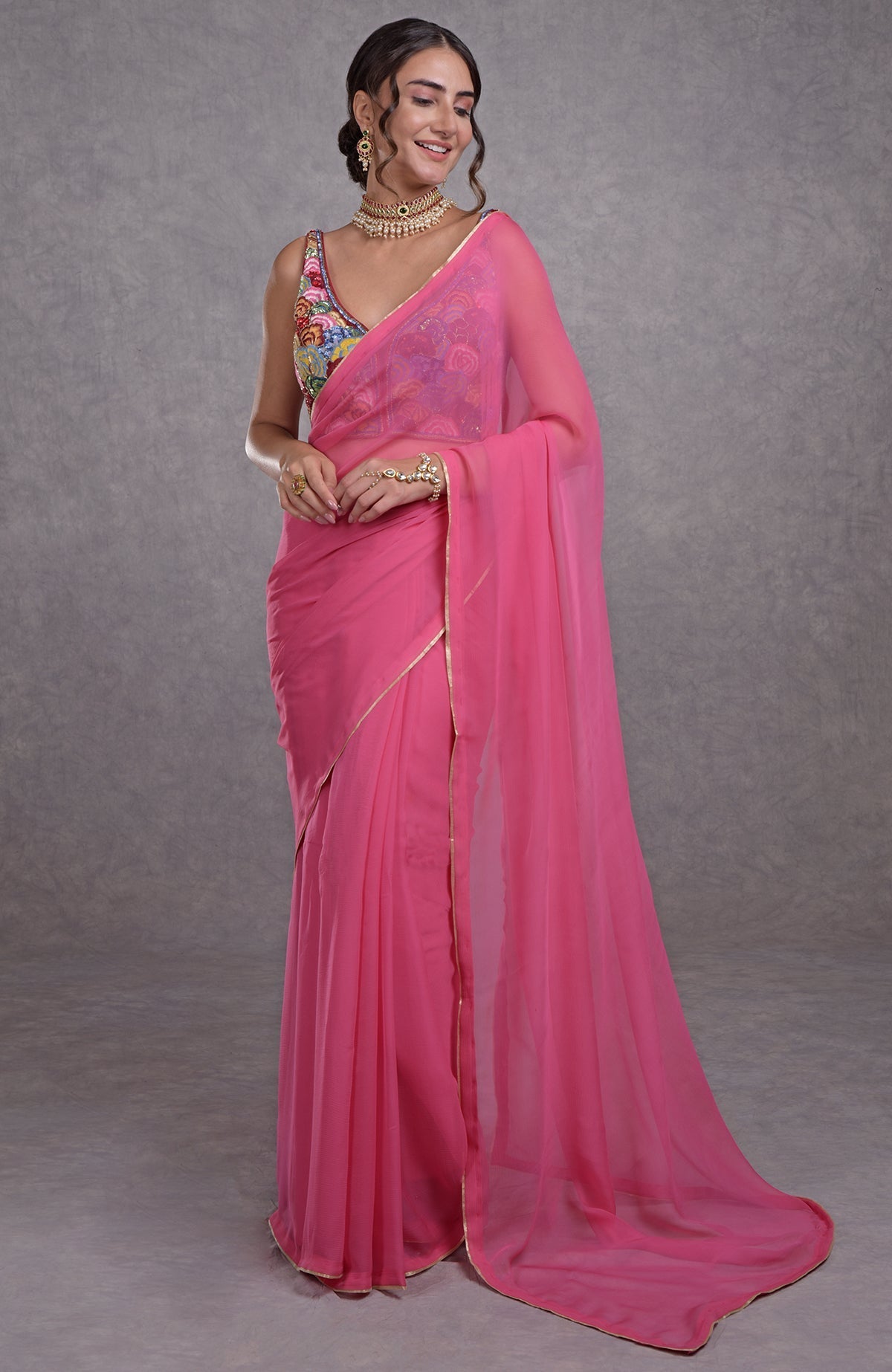 Hot pink saree with multicolor resham, dabka, sequin, and bead floral embroidery on blouse
