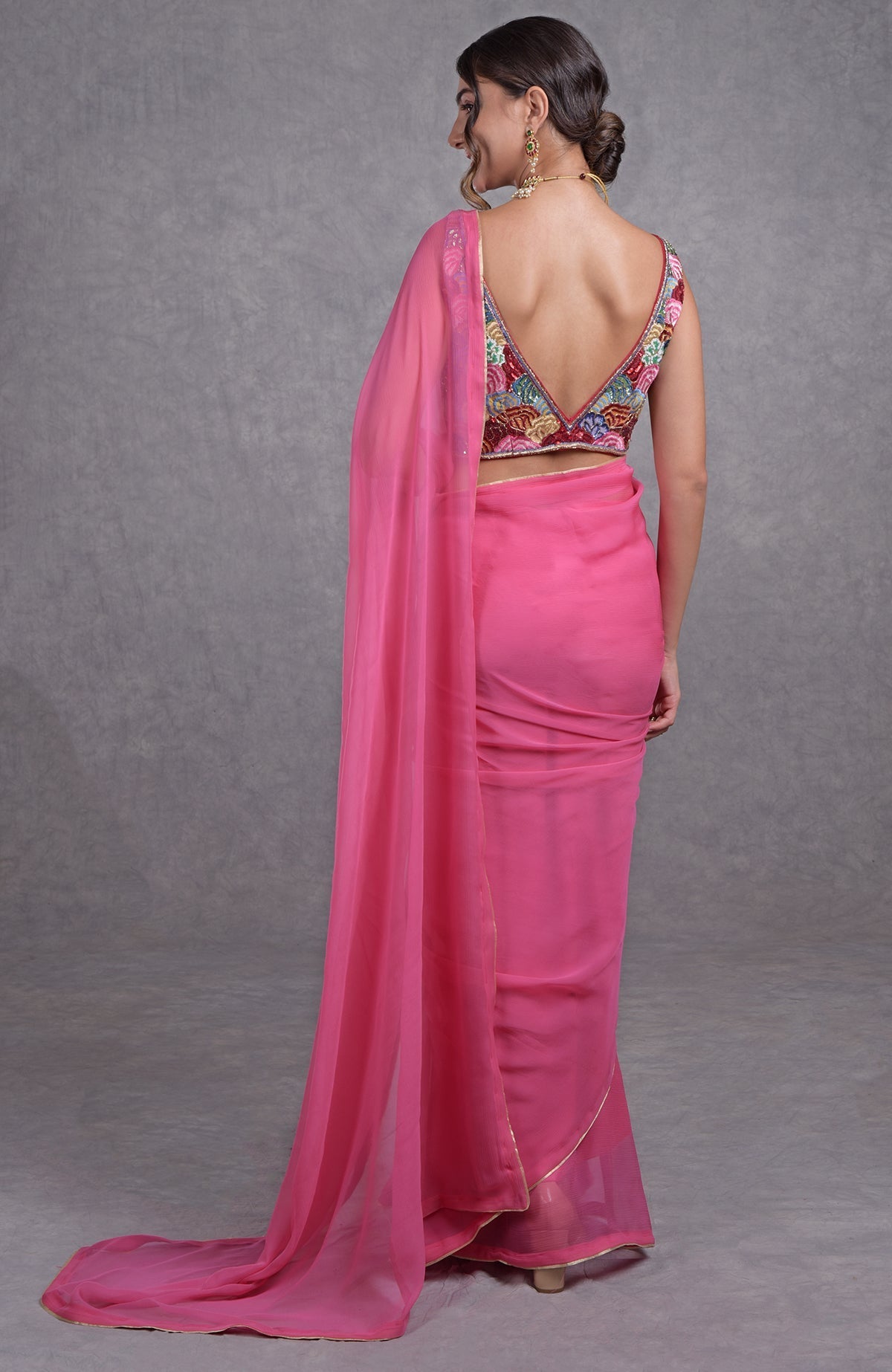 Hot pink saree with multicolor resham, dabka, sequin, and bead floral embroidery on blouse