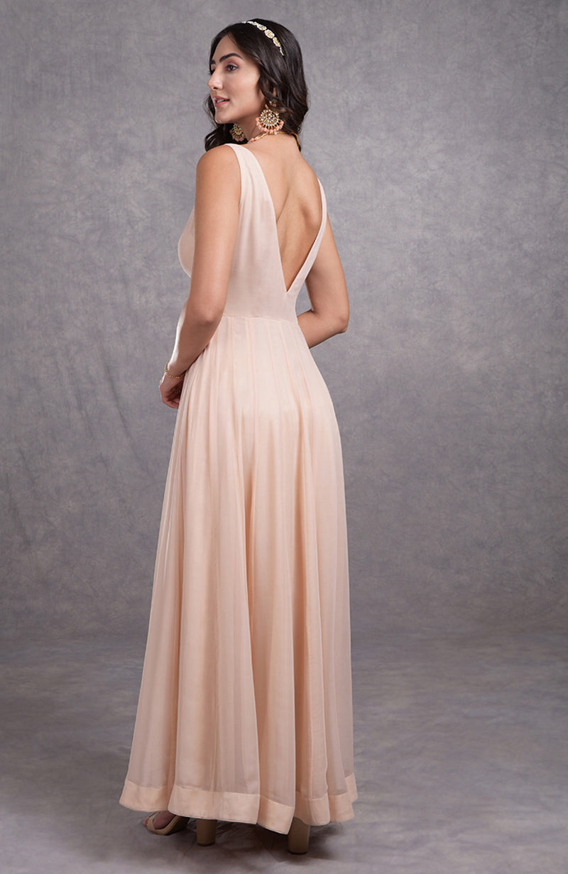 Nude pink georgette Anarkali suit with flared silhouette and sweetheart neckline.