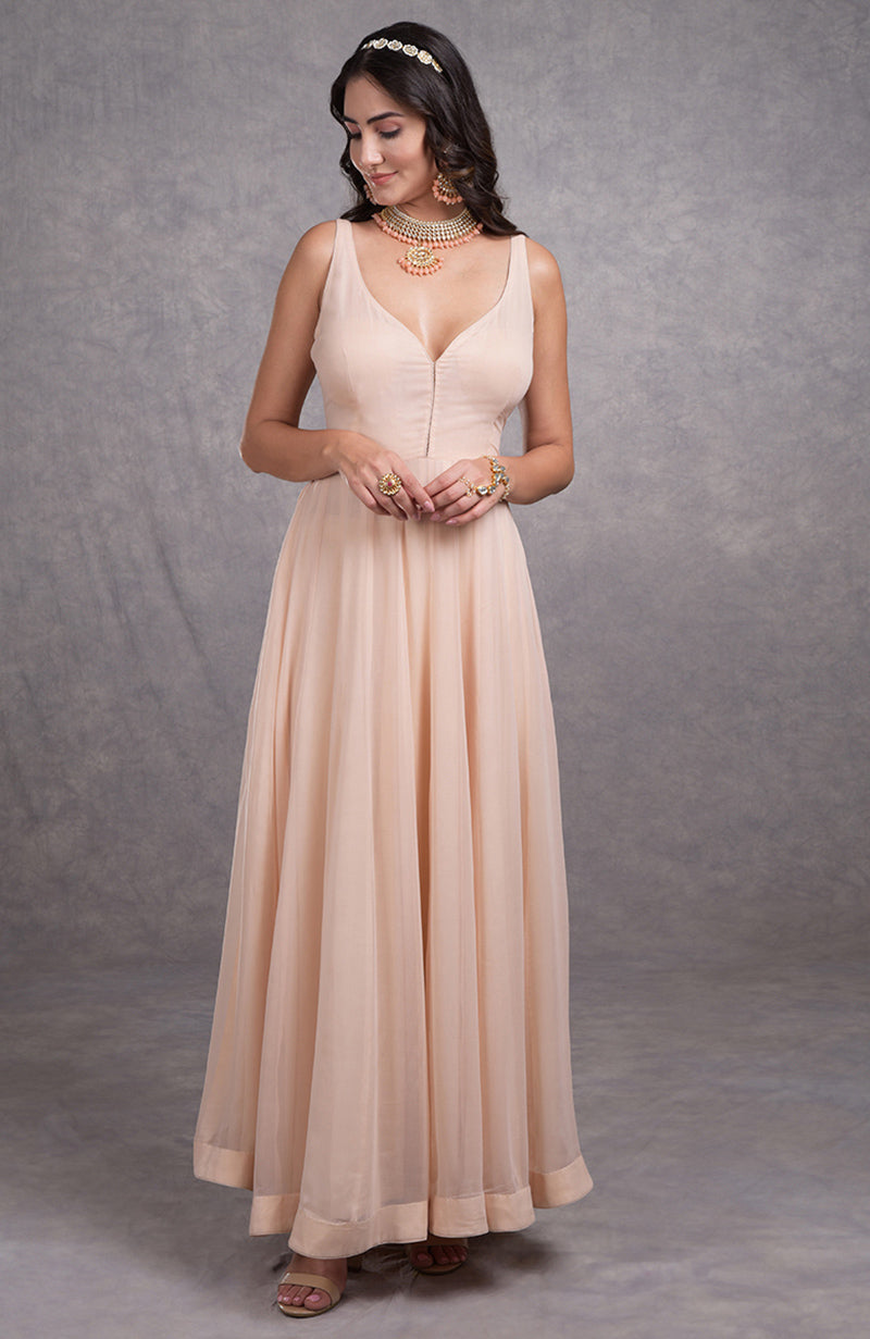 Nude pink georgette anarkali suit with flared silhouette and sweetheart neckline.