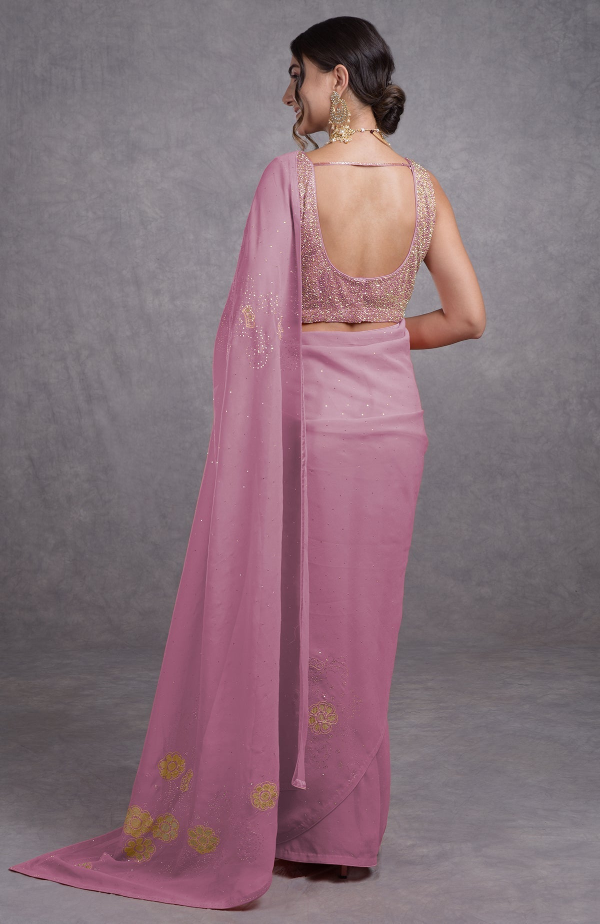 Orchid bouquet tissue cutwork hand embroidered mukaish saree with a deep back blouse.