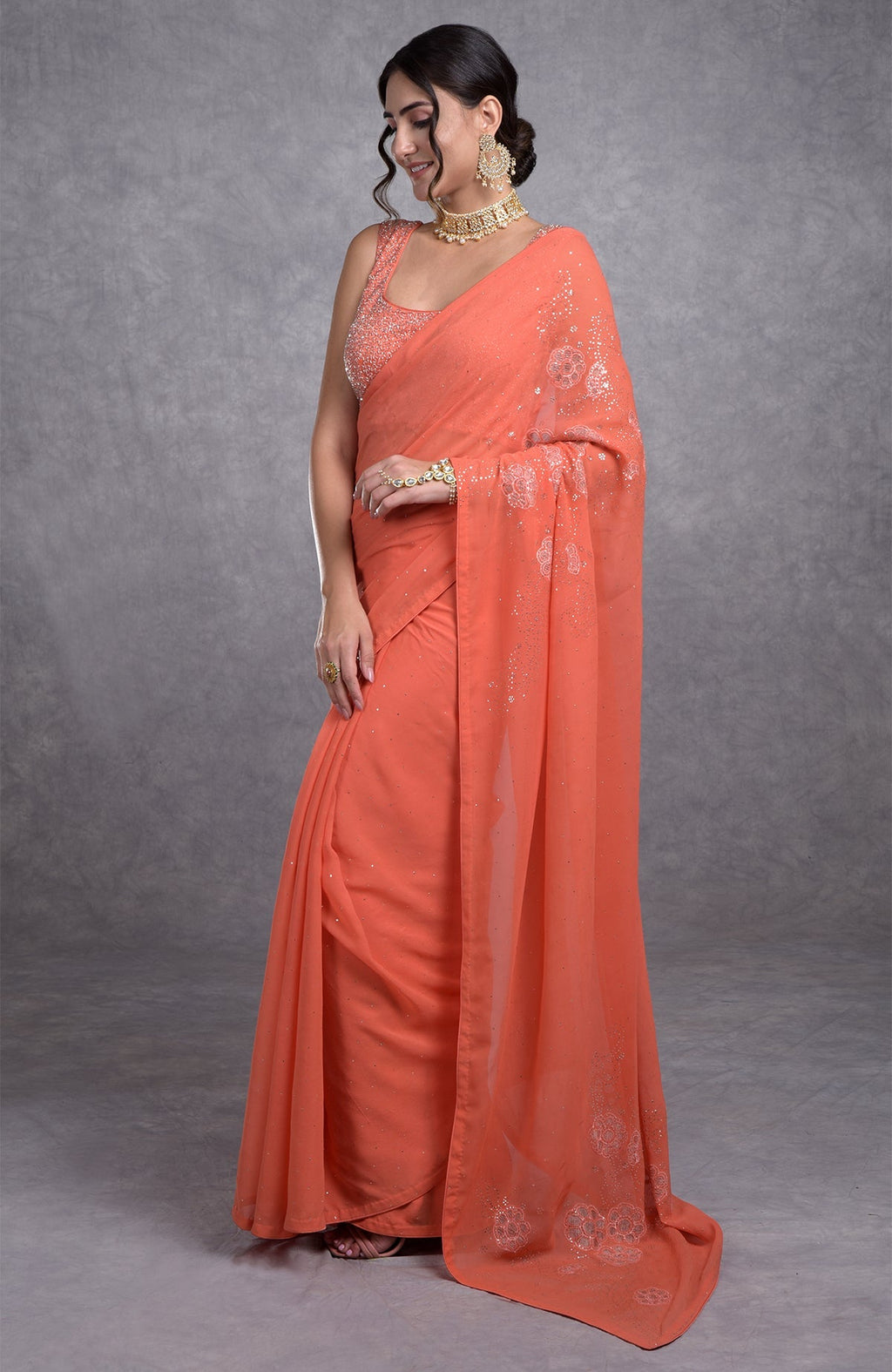 Peach camellia saree with hand-embroidered mukaish and tissue cutwork floral motifs