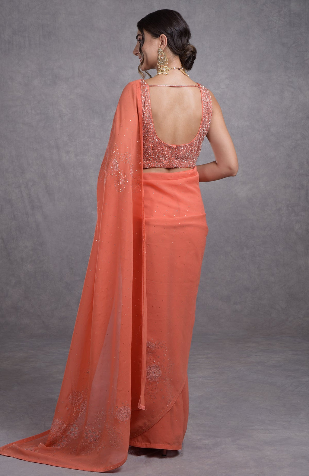 Peach camellia saree with hand-embroidered mukaish and tissue cutwork floral motifs