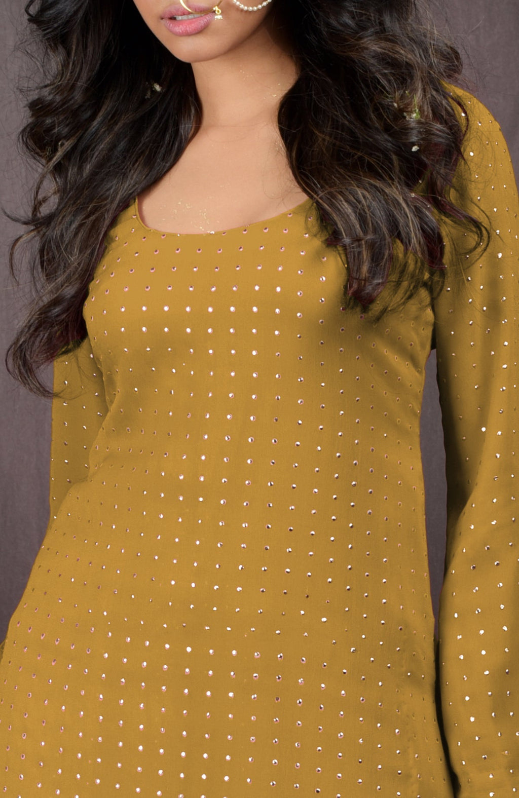 Mustard yellow sharara set with gold embossed details and a scoop neckline.
