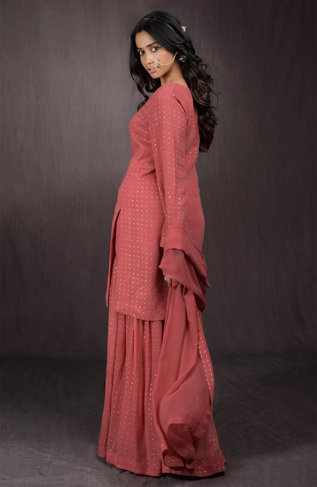 Desert Rose sharara set in georgette with gold embellishments on kurta, sharara, and dupatta.