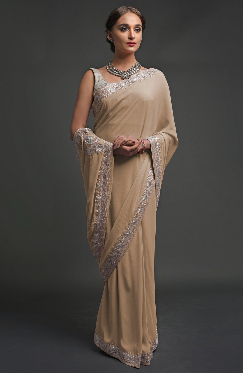 Beige georgette saree with silver Kashmiri tilla lotus embroidery on pallav and borders