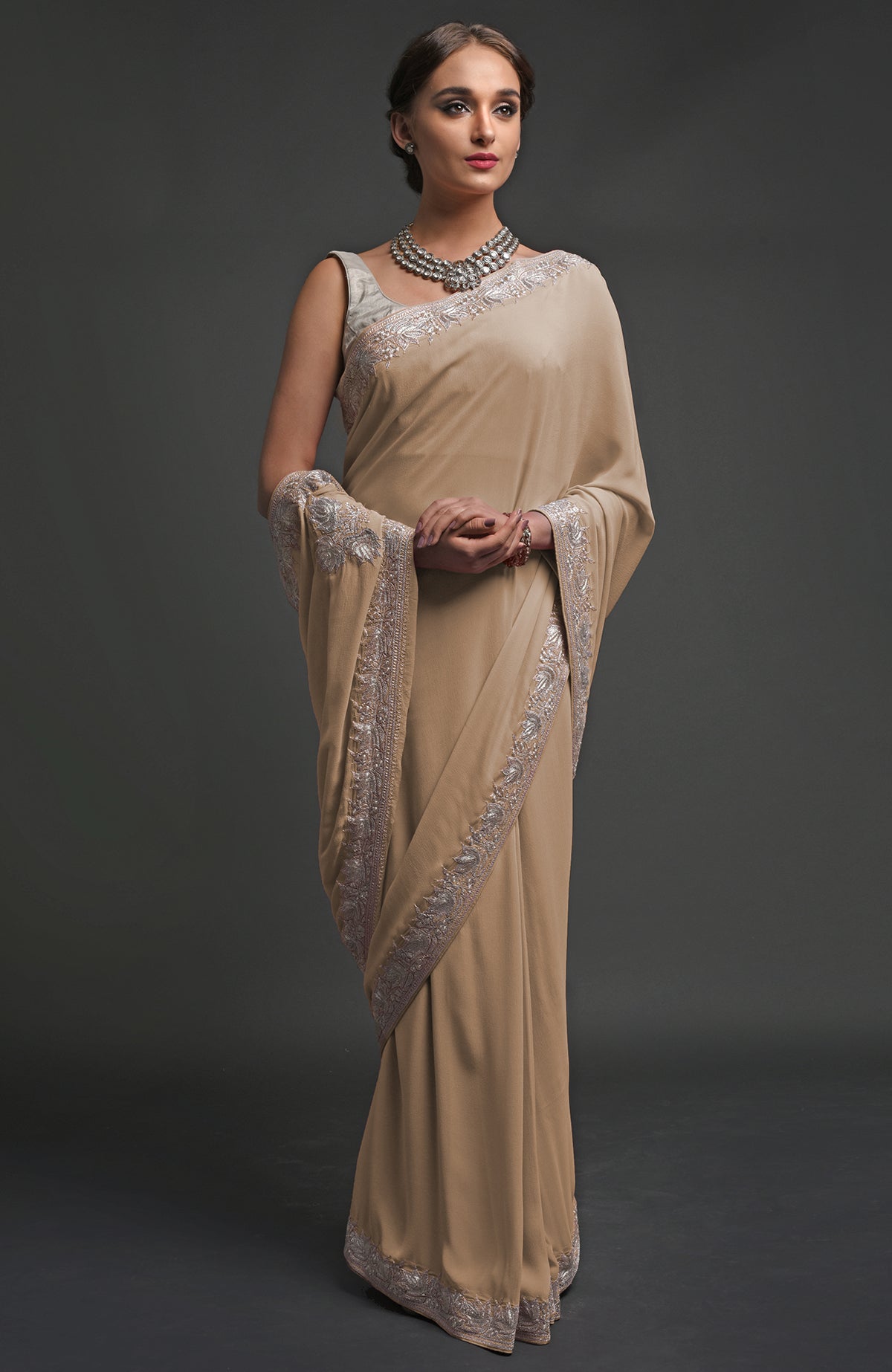 Beige georgette saree with silver Kashmiri tilla lotus embroidery on pallav and borders