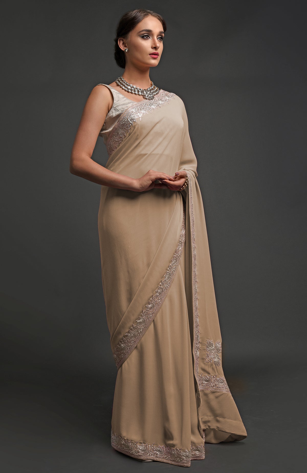 Beige georgette saree with silver Kashmiri tilla lotus embroidery on pallav and borders
