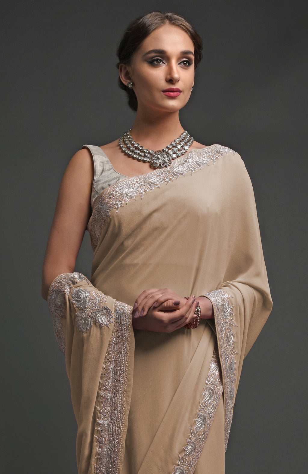 Beige georgette saree with silver Kashmiri tilla lotus embroidery on pallav and borders
