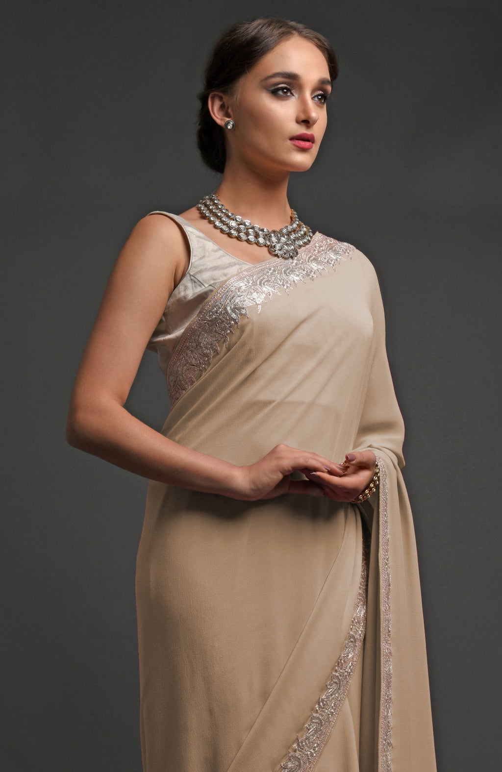 Beige georgette saree with silver Kashmiri tilla lotus embroidery on pallav and borders
