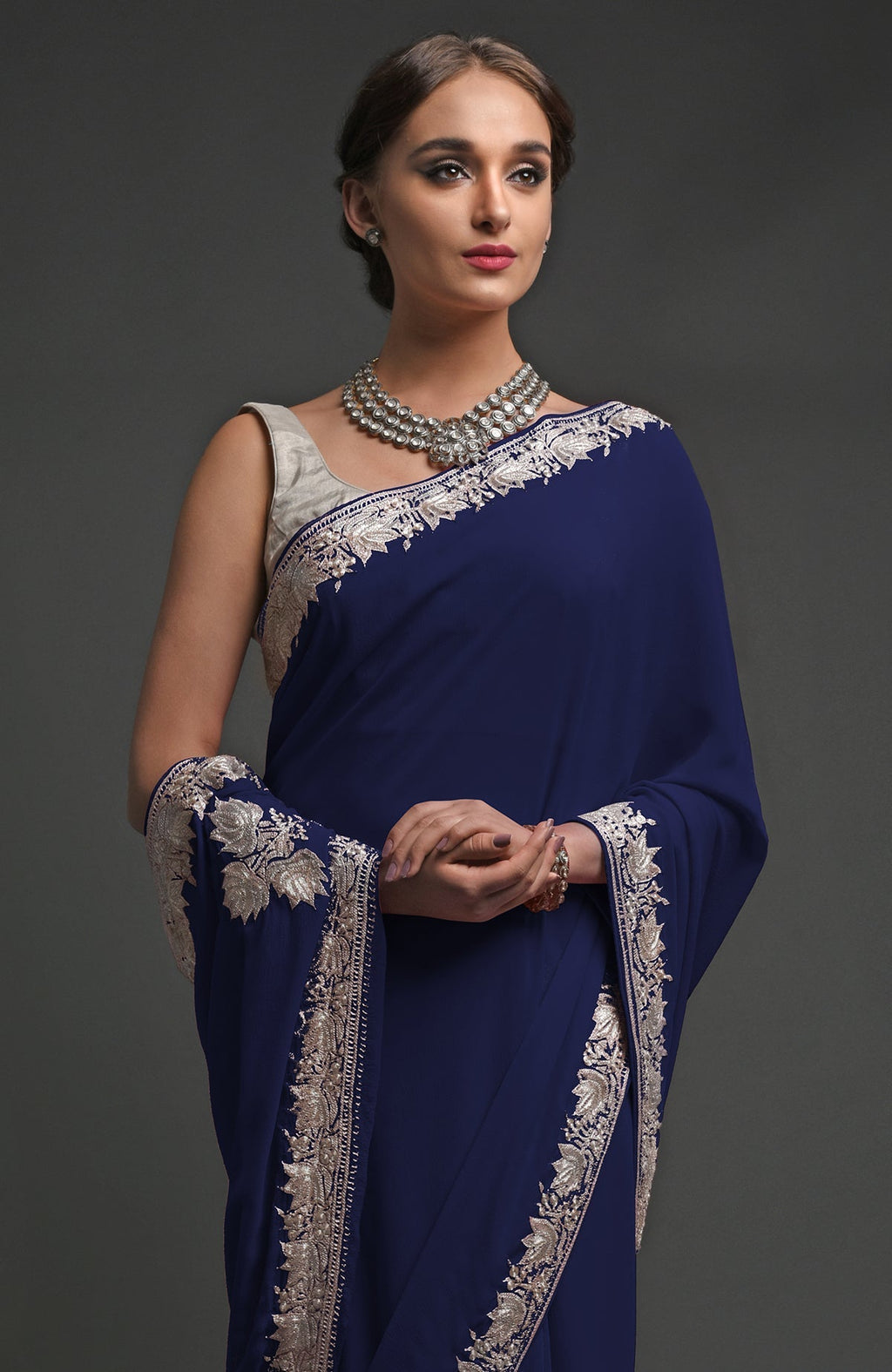 Navy blue georgette saree with silver Kashmiri tilla lotus embroidery on pallav and borders