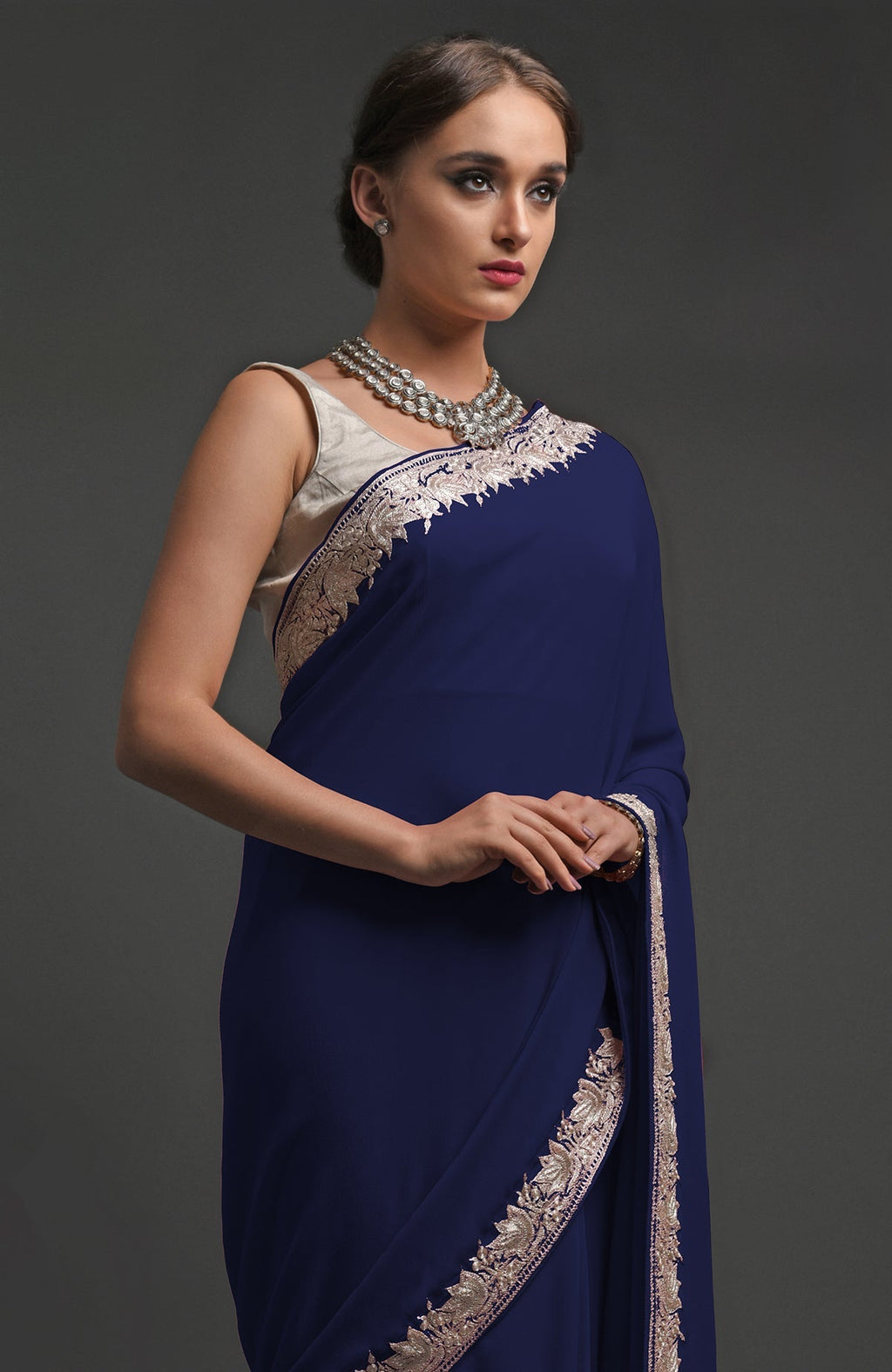 Navy blue georgette saree with silver Kashmiri tilla lotus embroidery on borders and pallav