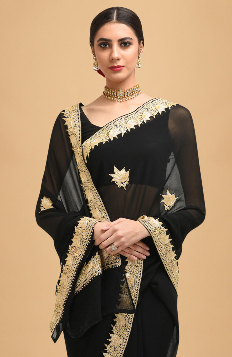 Black georgette saree with gold Kashmiri tilla lotus embroidery on pallav and borders