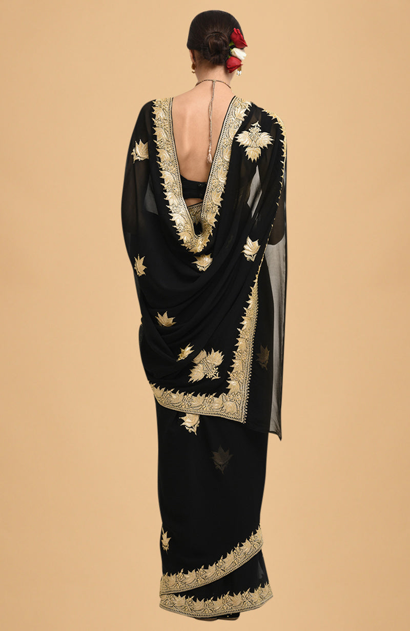 Black georgette saree with gold Kashmiri tilla lotus embroidery on pallav and borders
