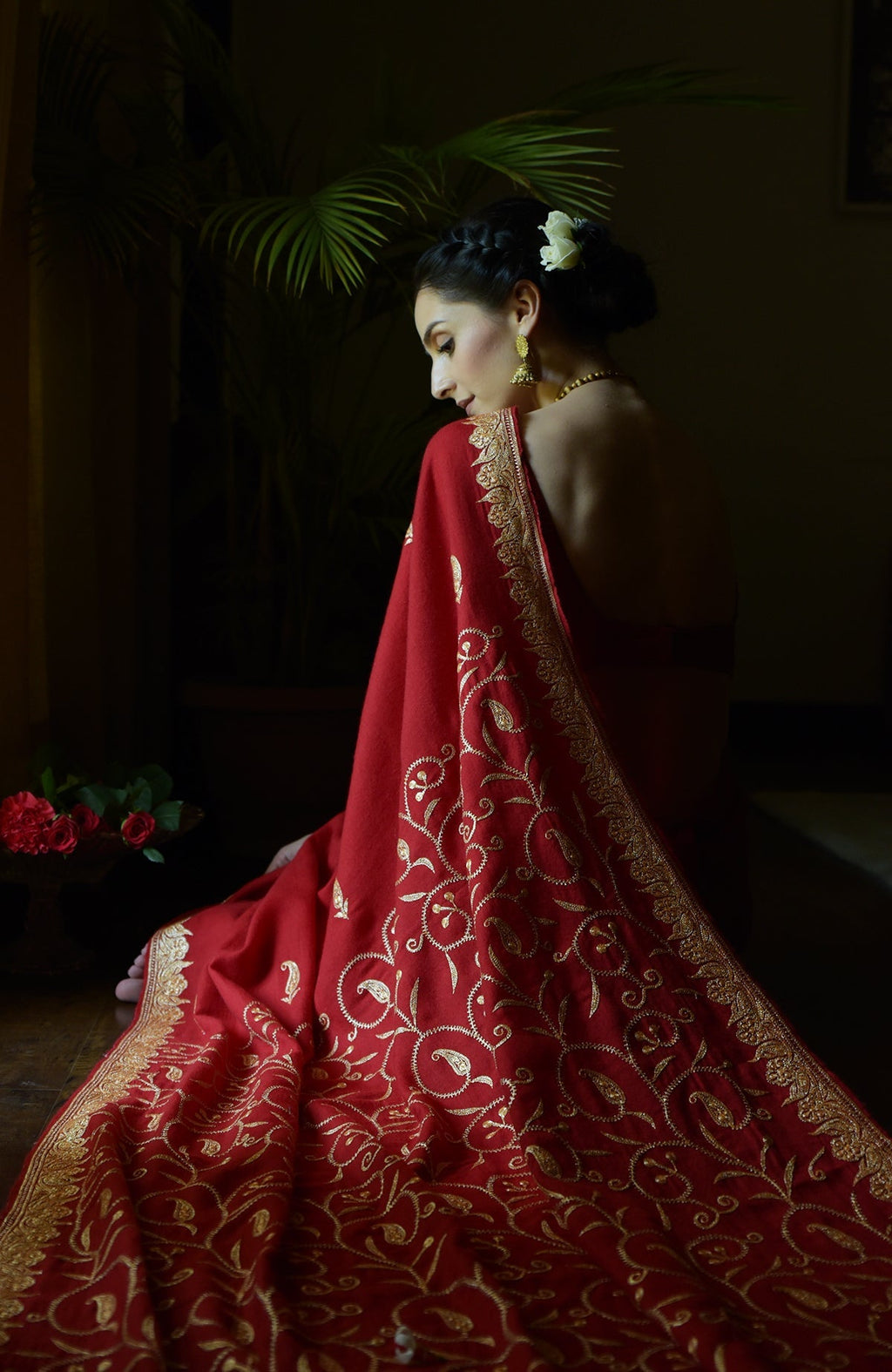 Red pure crepe saree with gold Kashmiri tilla embroidery and paisley bootis on pallav and blouse.
