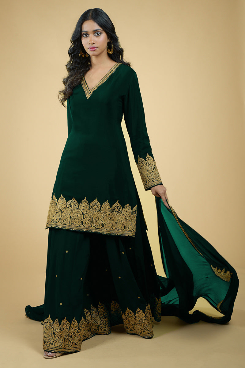 Emerald green crepe sharara set with gold Kashmiri tilla aari floral and paisley embroidery.