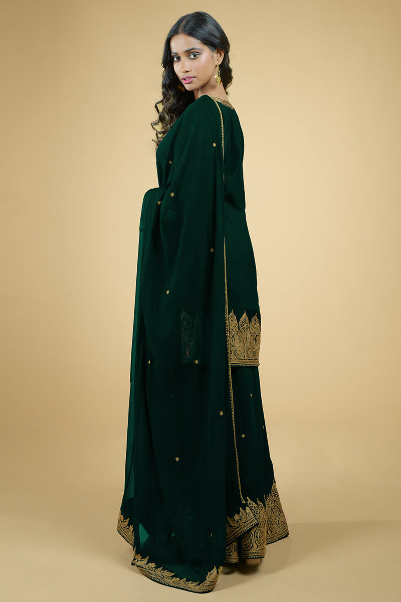 Emerald green sharara set with gold Kashmiri Tilla Aari embroidery and chiffon dupatta.