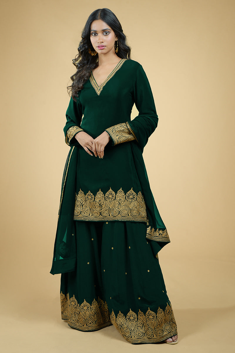 Plum crepe sharara set with gold Kashmiri Tilla Aari floral and paisley embroidery.