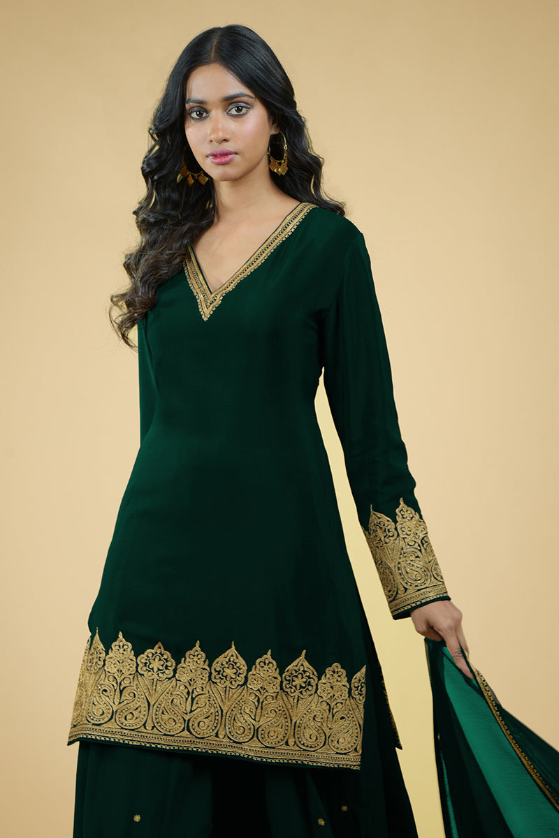 Emerald green crepe sharara set with gold Kashmiri tilla aari floral embroidery and chiffon dupatta.