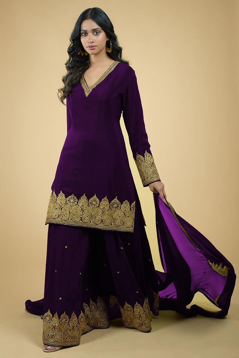 Plum crepe sharara set with gold Kashmiri tilla aari embroidery and chiffon dupatta.