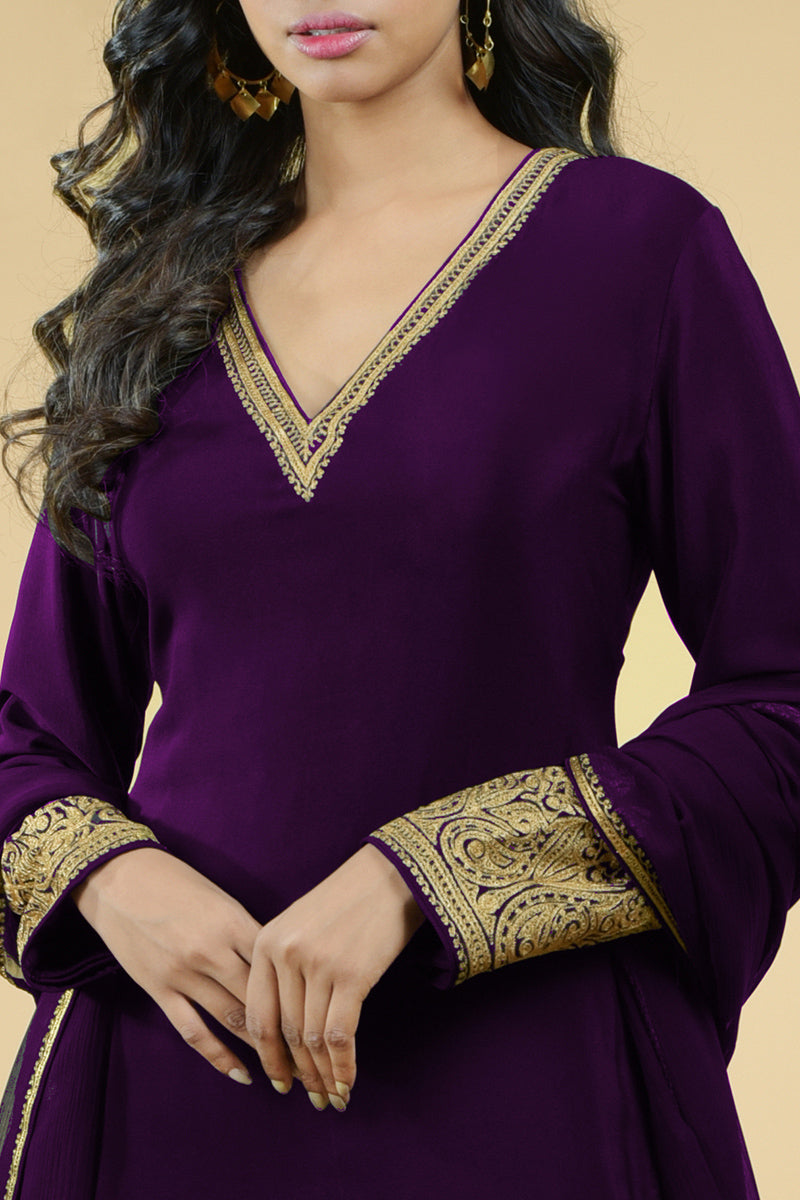 Plum crepe sharara set with gold Kashmiri tilla aari floral and paisley embroidery.