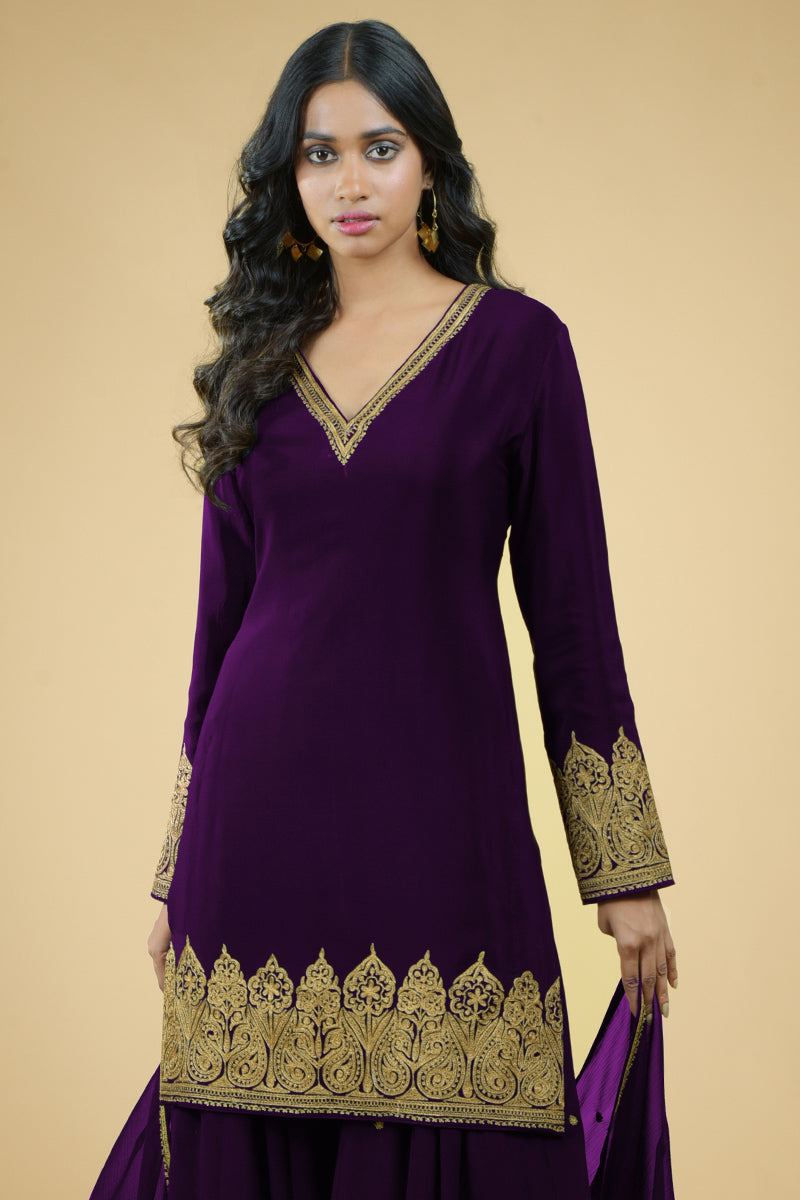 Plum crepe sharara set with gold Kashmiri tilla aari embroidery and chiffon dupatta.