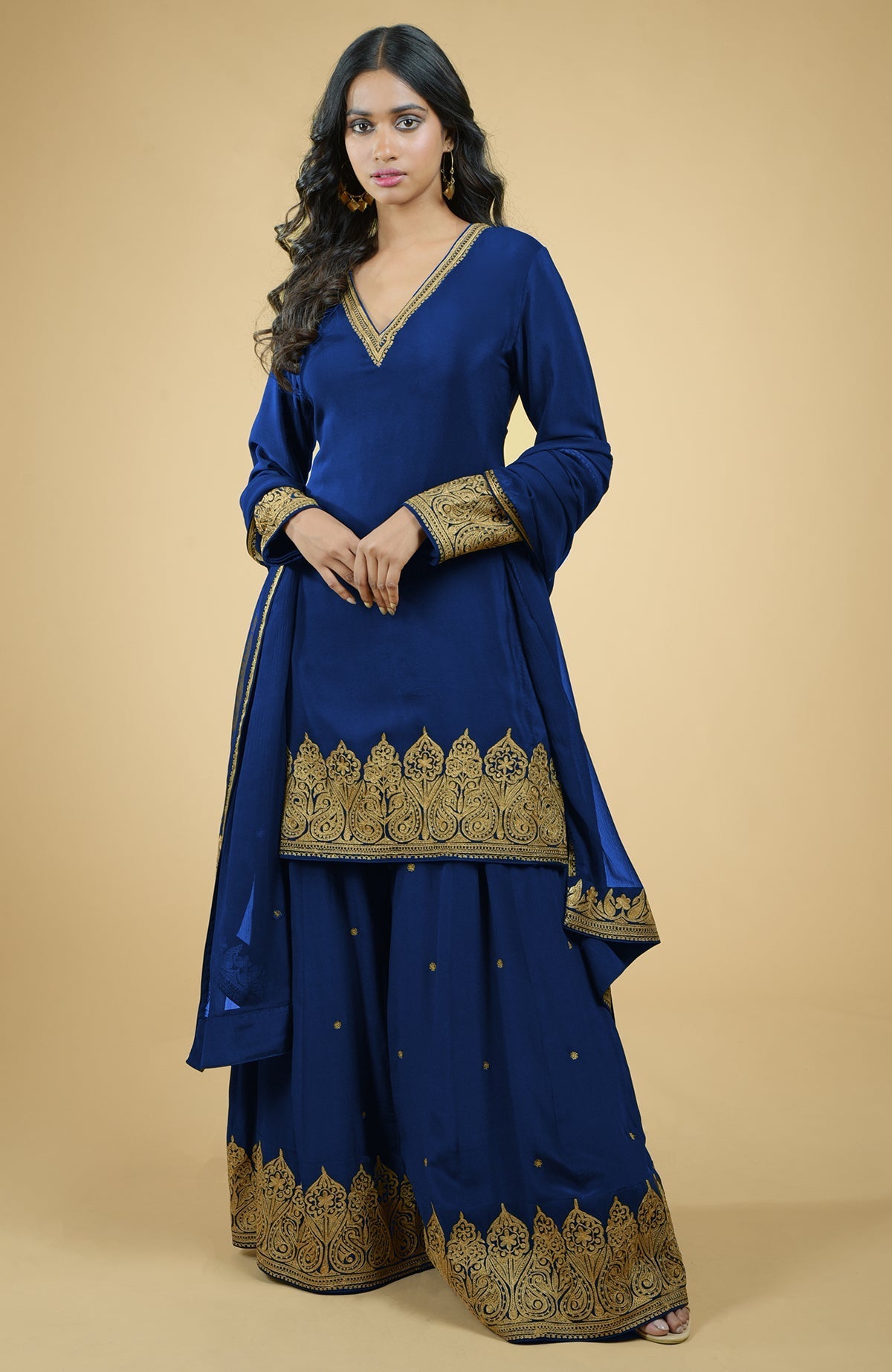 Cobalt blue sharara set with gold Kashmiri tilla aari floral and paisley embroidery.
