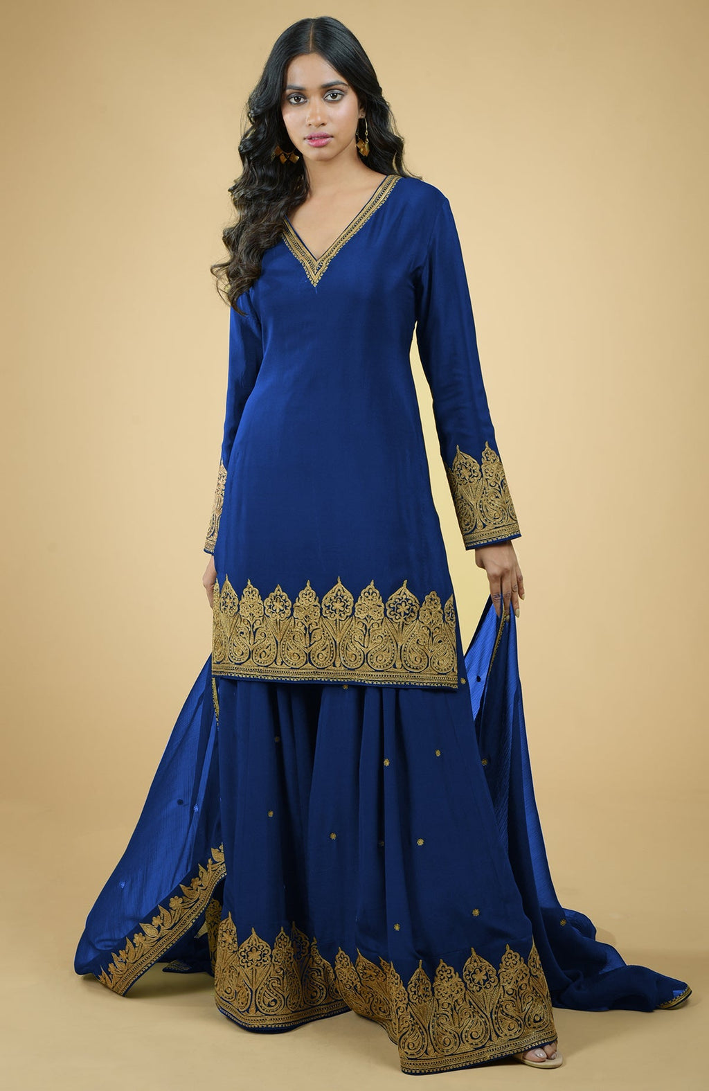 Cobalt blue sharara set with gold Kashmiri tilla aari embroidery and chiffon dupatta.