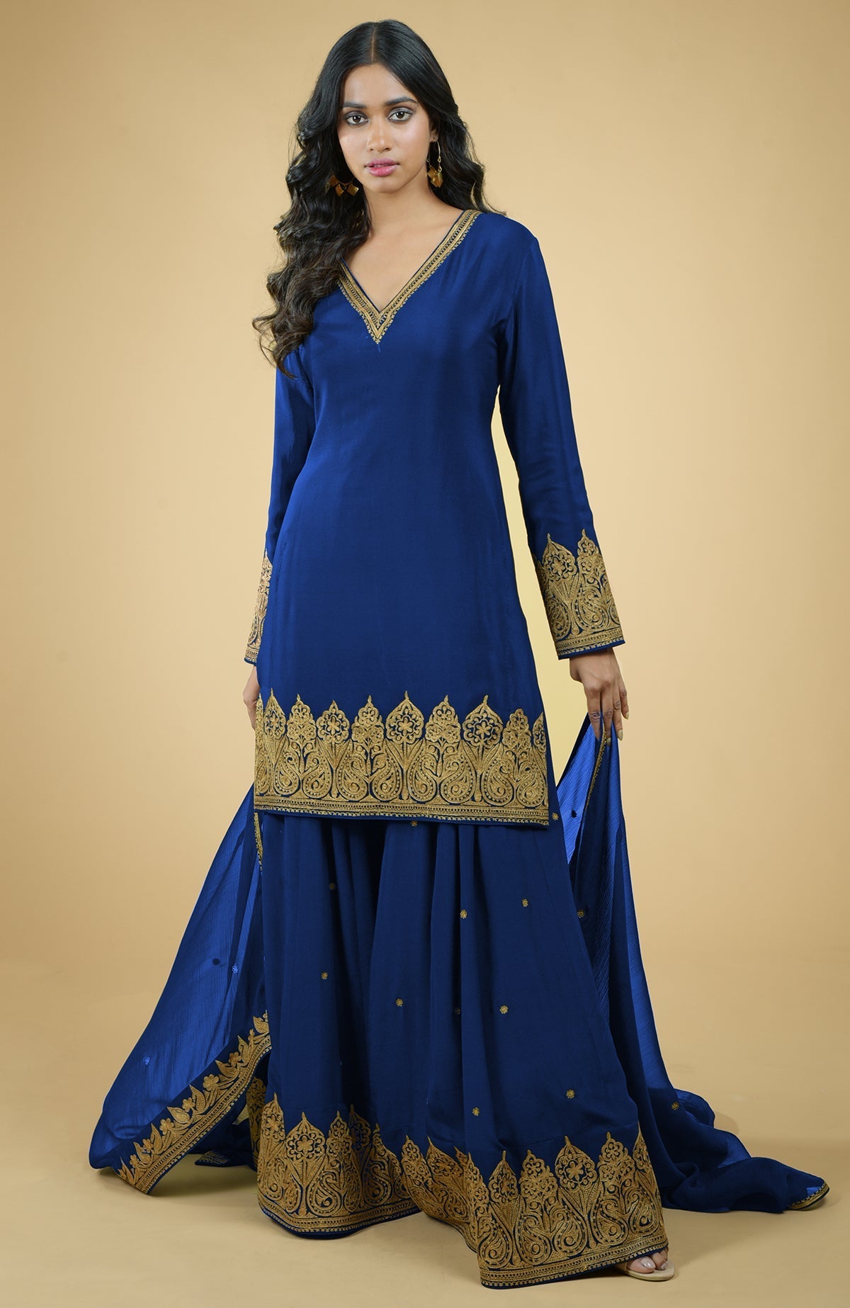 Cobalt blue sharara set with gold Kashmiri tilla aari embroidery and chiffon dupatta.