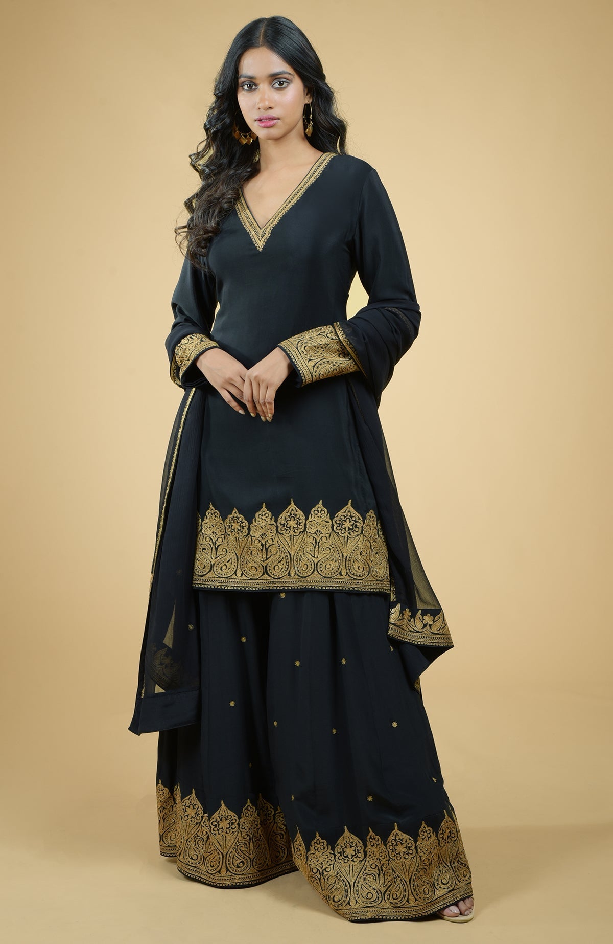 Emerald green crepe sharara set with gold Kashmiri Tilla Aari floral and paisley embroidery