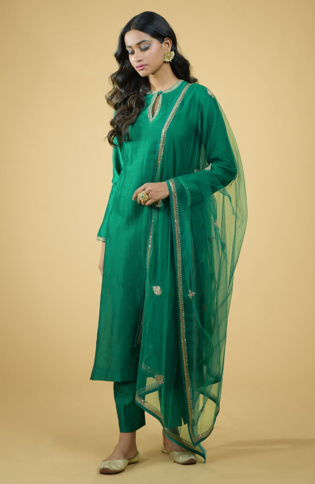 Emerald green kurta set with gold hand-embroidered zardozi floral work and matching pants