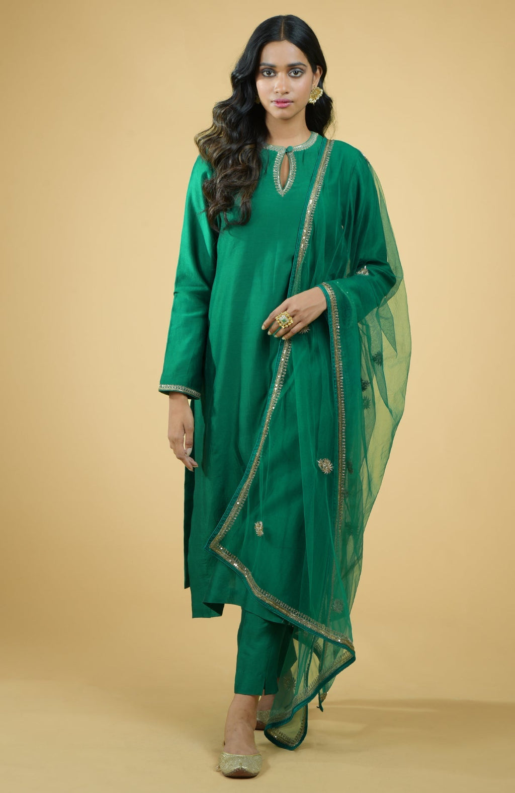 Emerald green kurta set with gold hand-embroidered zardozi floral work and matching pants