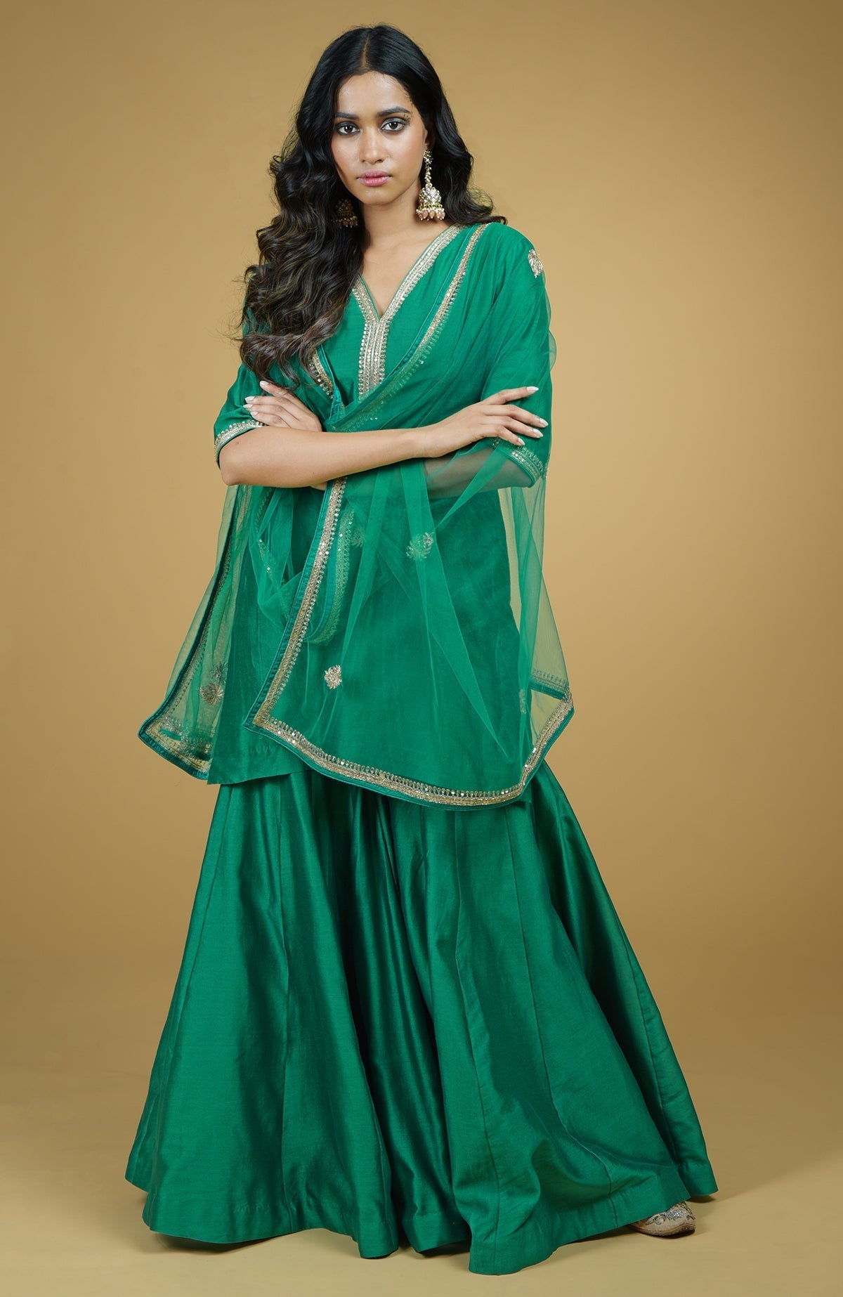 Emerald green Gharara set with gold hand-embroidered zardozi on kurta and net dupatta