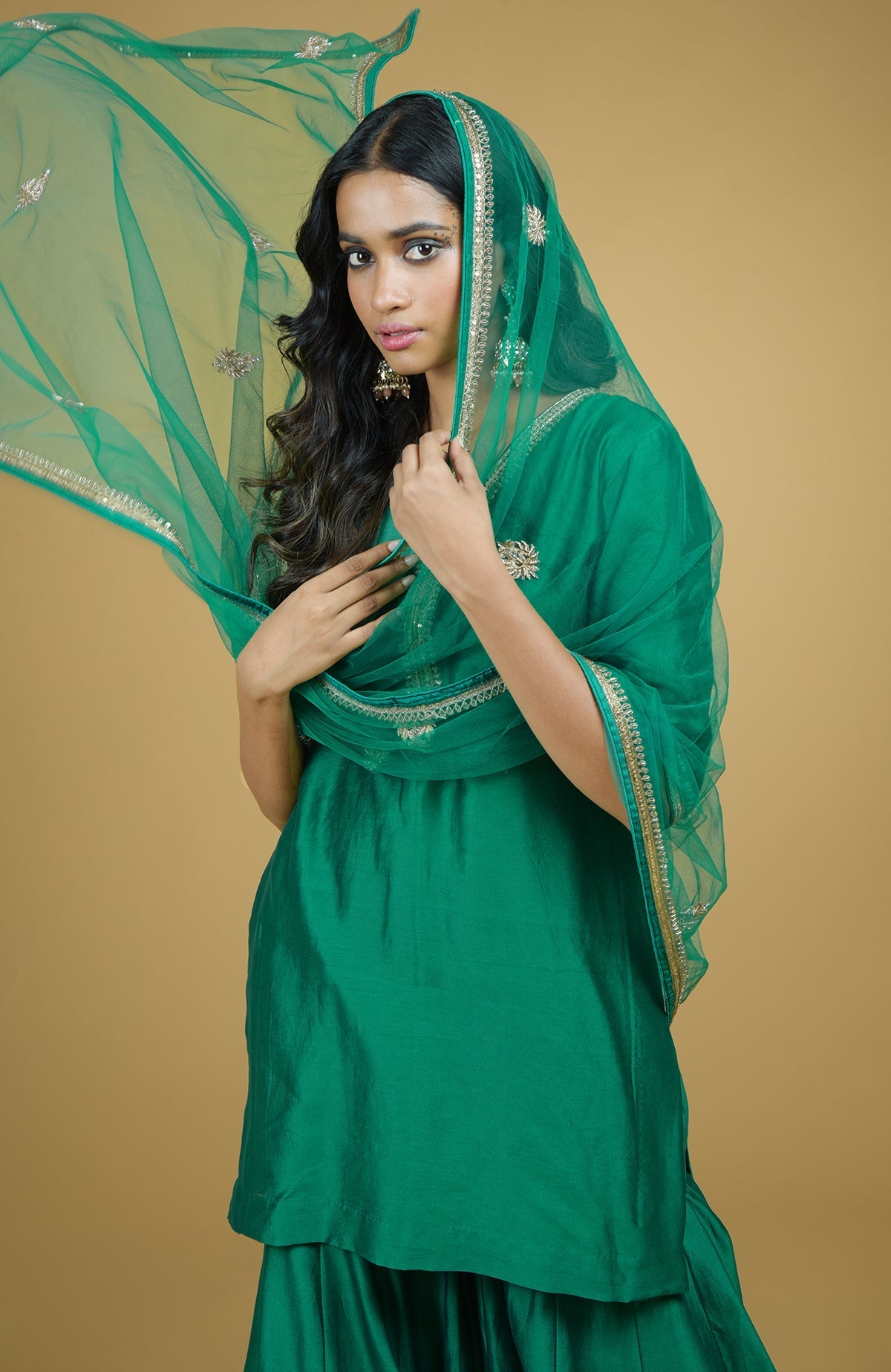 Emerald green kurta set with gold hand-embroidered zardozi floral work and matching pants