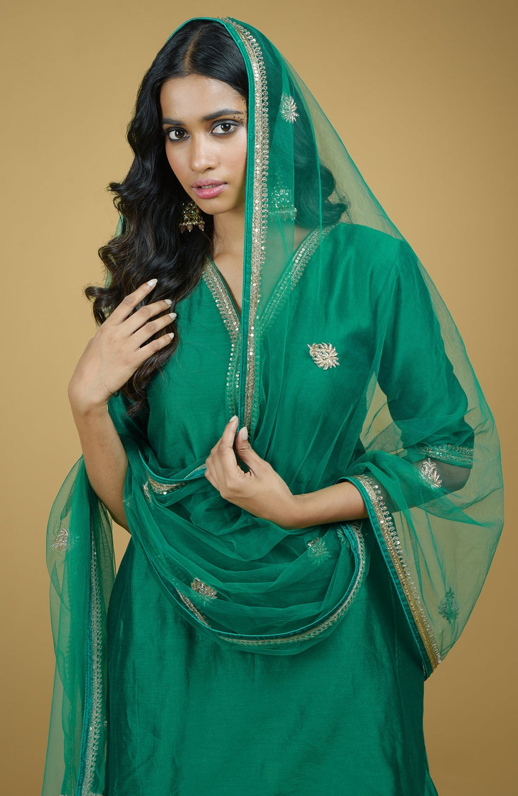 Emerald green kurta set with gold hand-embroidered zardozi floral work and matching pants