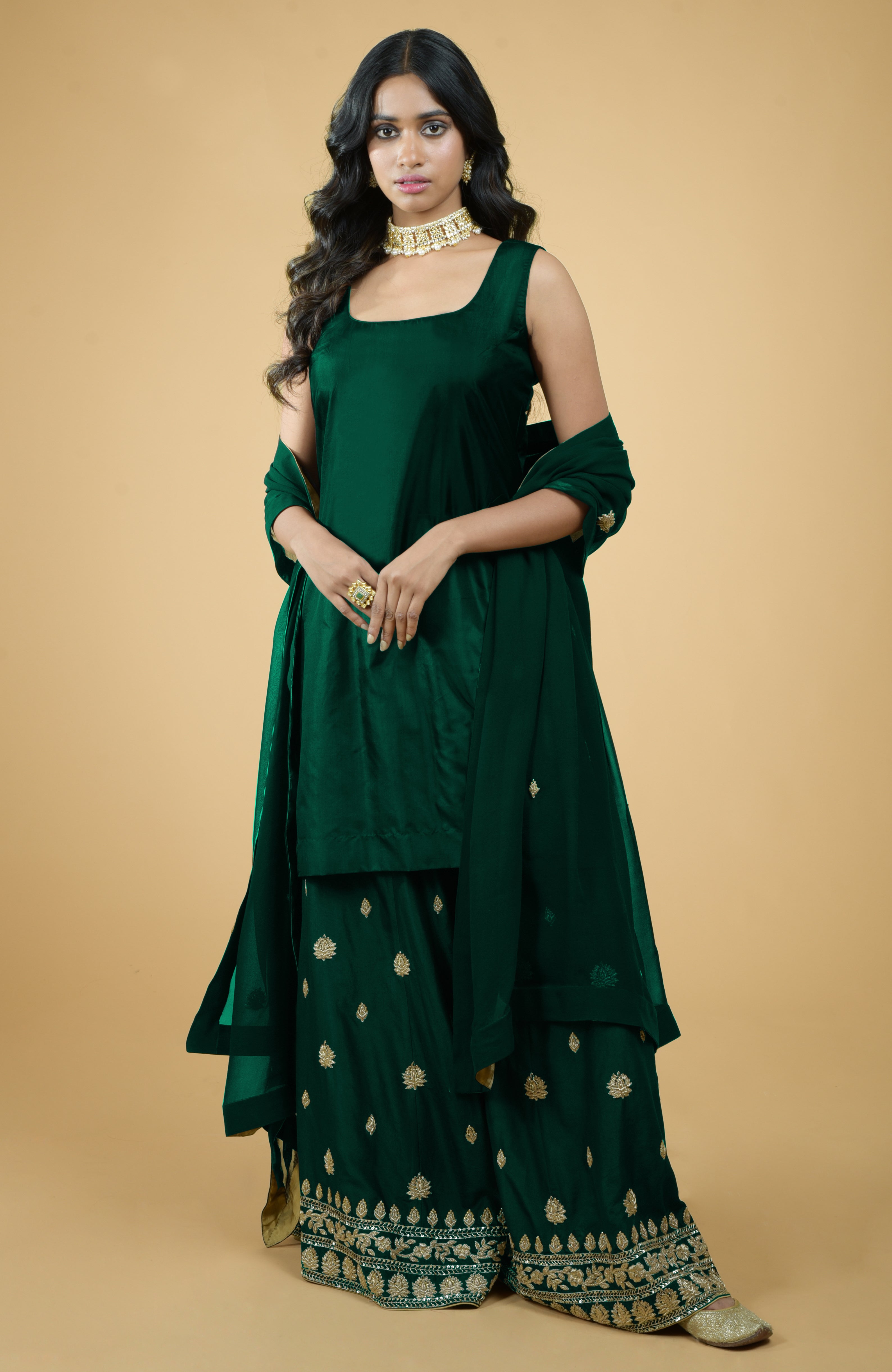 Emerald green silk sharara set with gold zardozi dabka and sequin hand embroidery