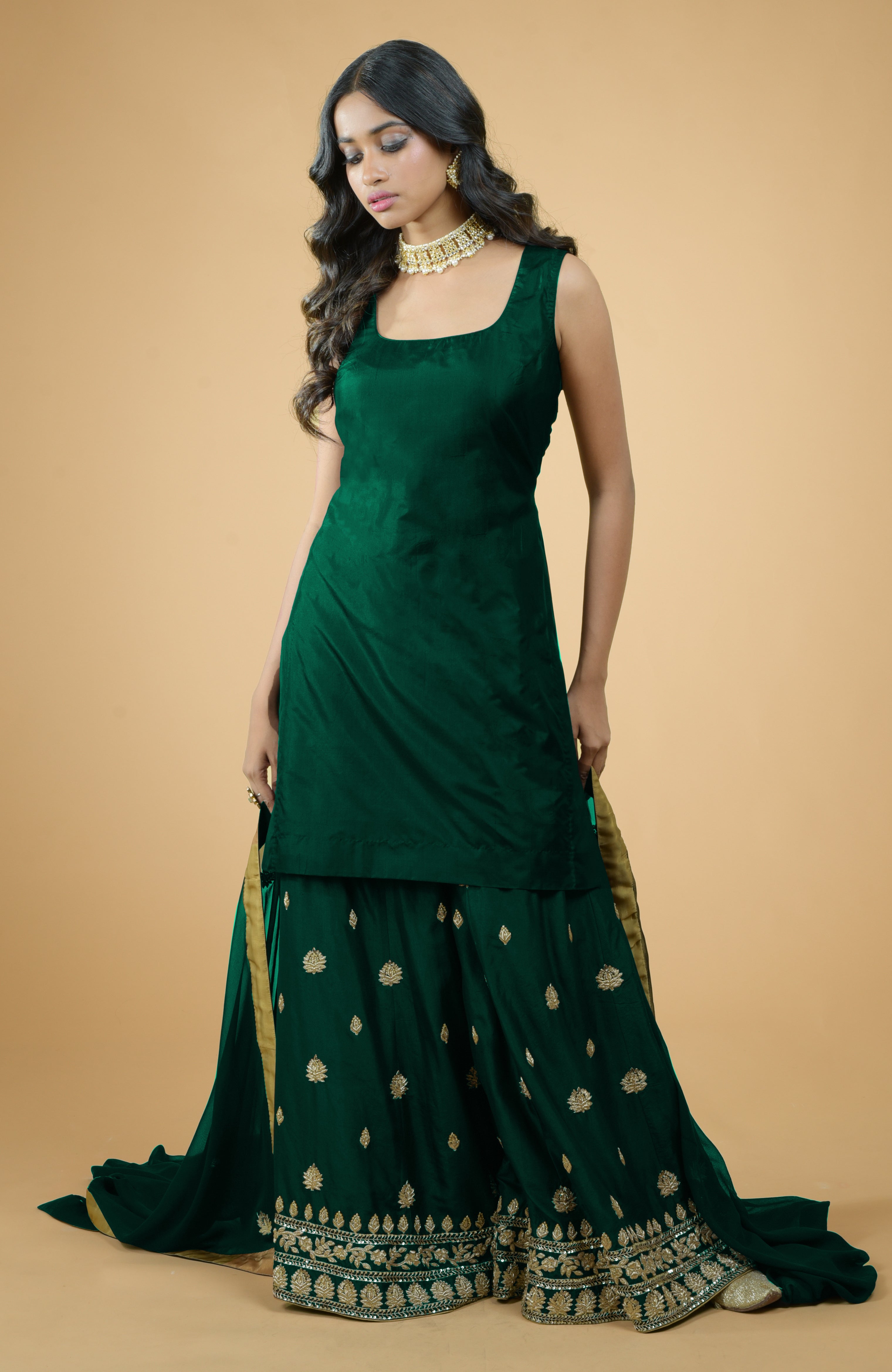 Emerald green silk sharara set with gold zardozi dabka and sequin hand embroidery and georgette dupatta