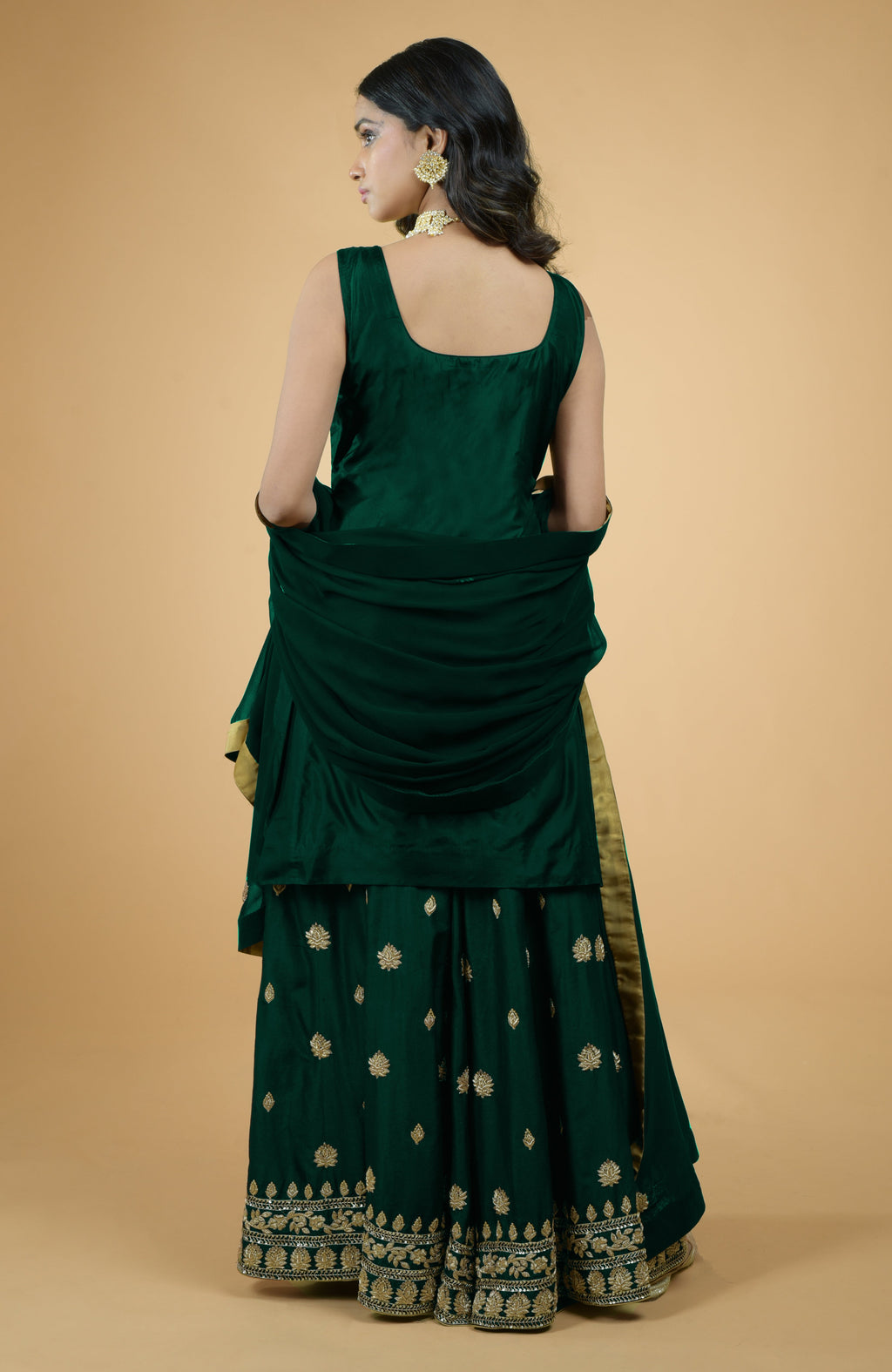 Emerald green silk sharara set with gold zardozi dabka and sequin hand embroidery and georgette dupatta