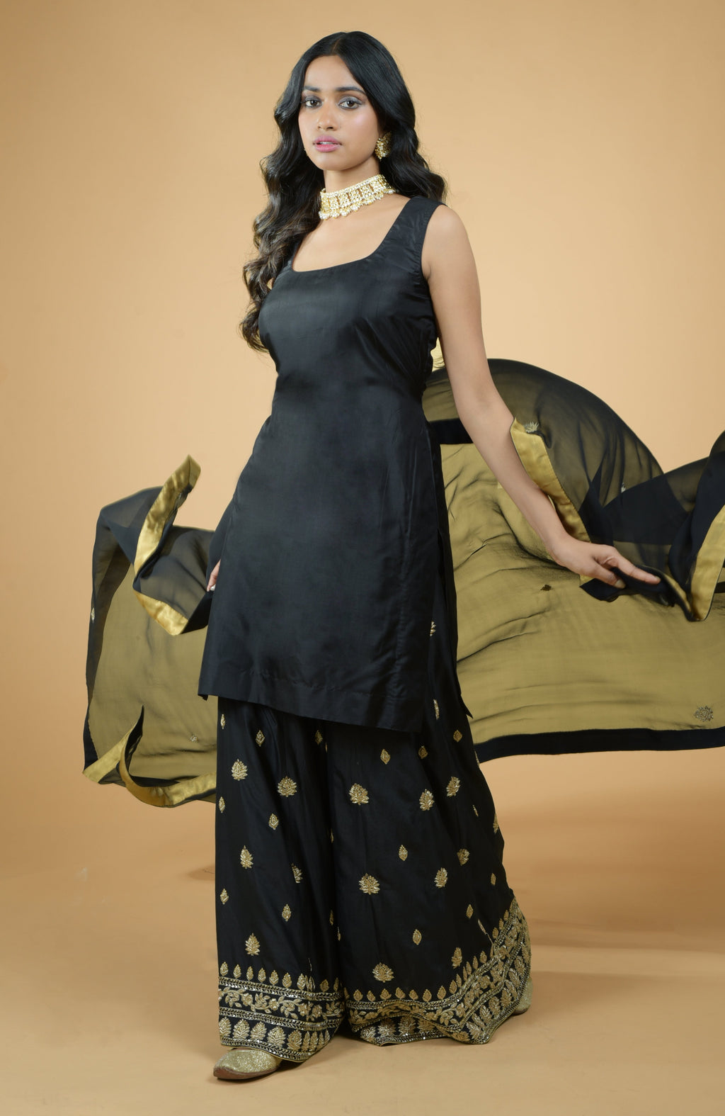 Black silk sharara set with gold zardozi dabka hand embroidery and georgette dupatta