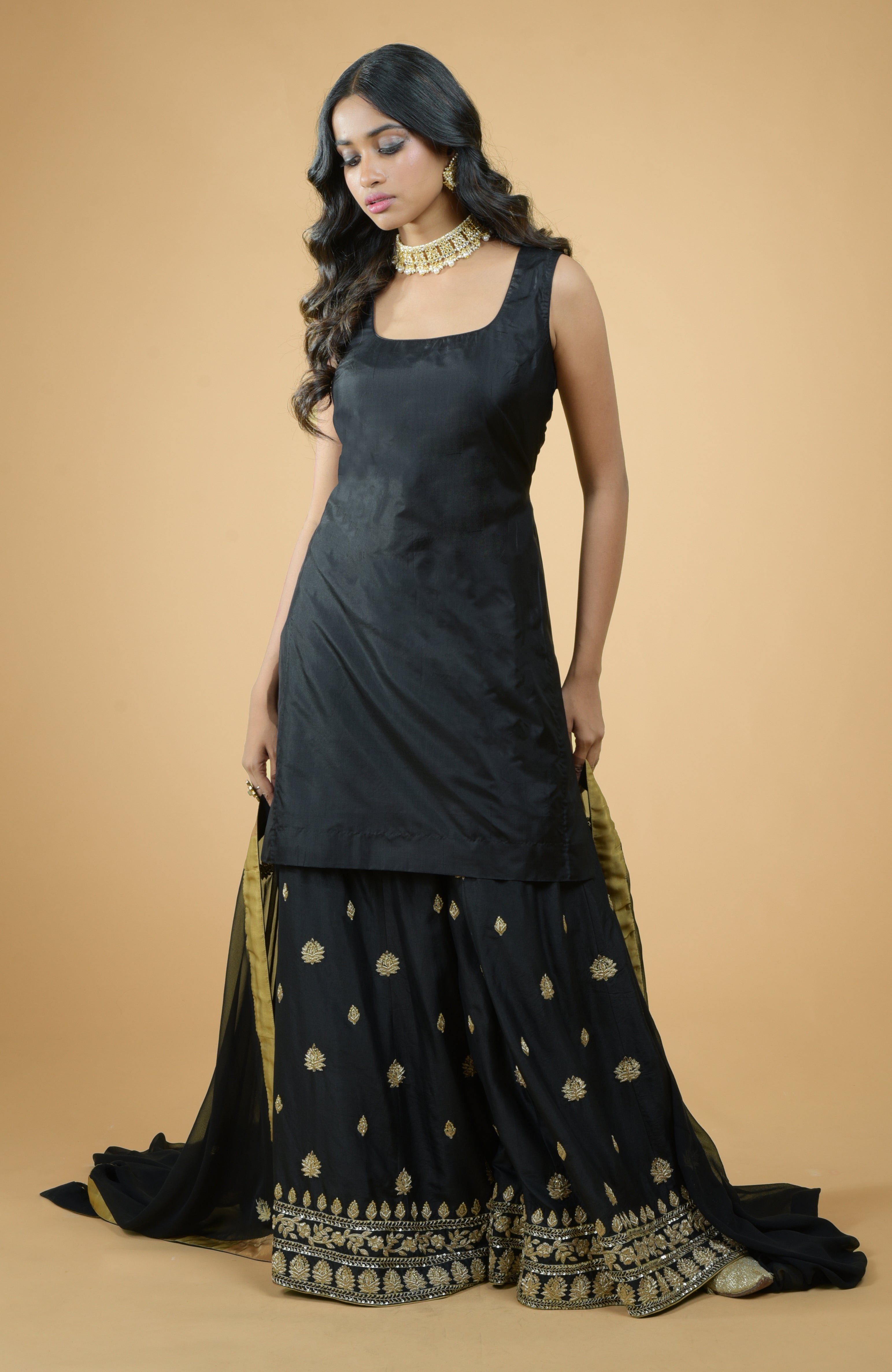 Black silk sharara set with gold zardozi dabka hand embroidery and georgette dupatta