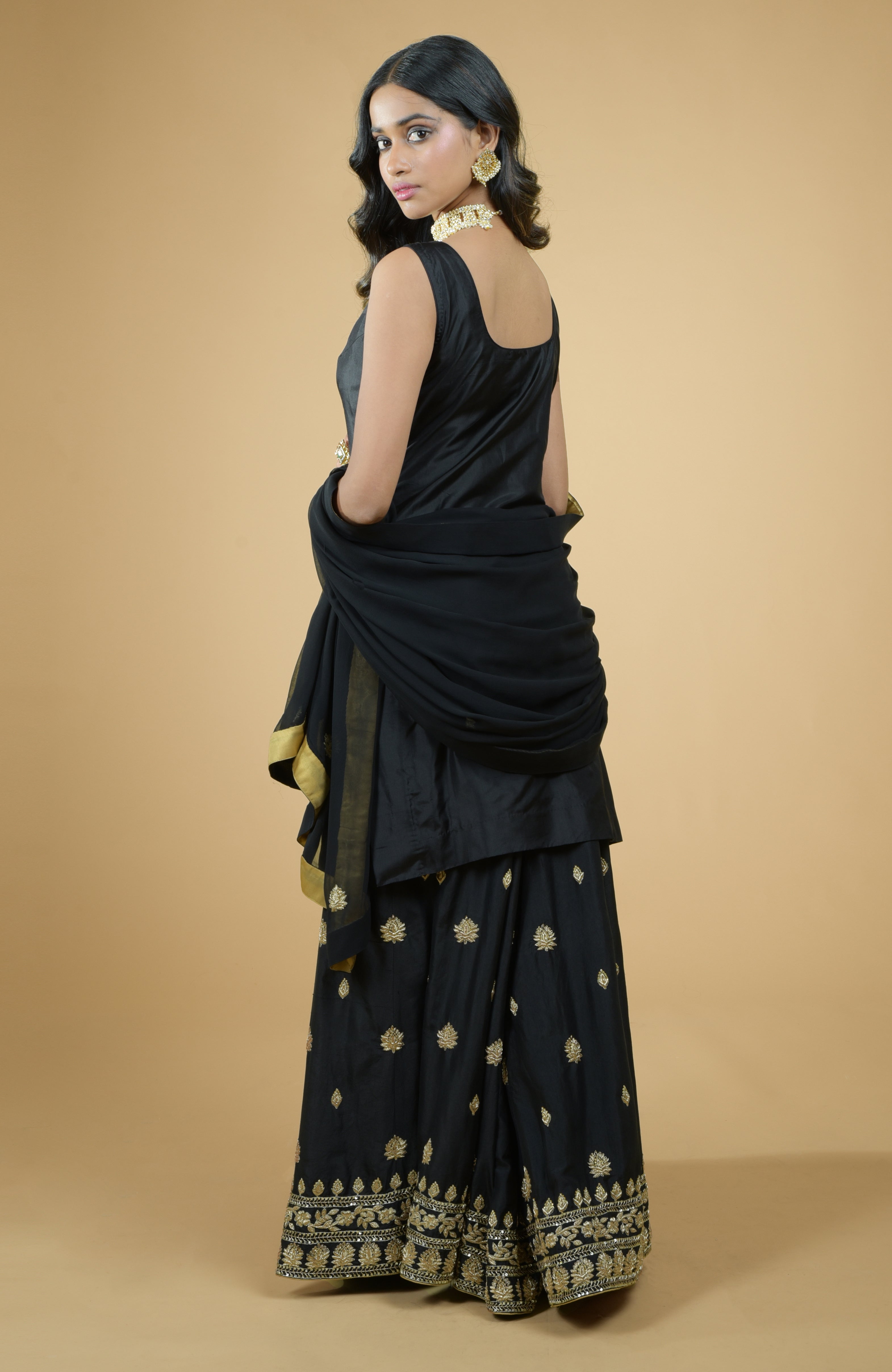Black silk sharara set with gold zardozi dabka floral embroidery and georgette dupatta